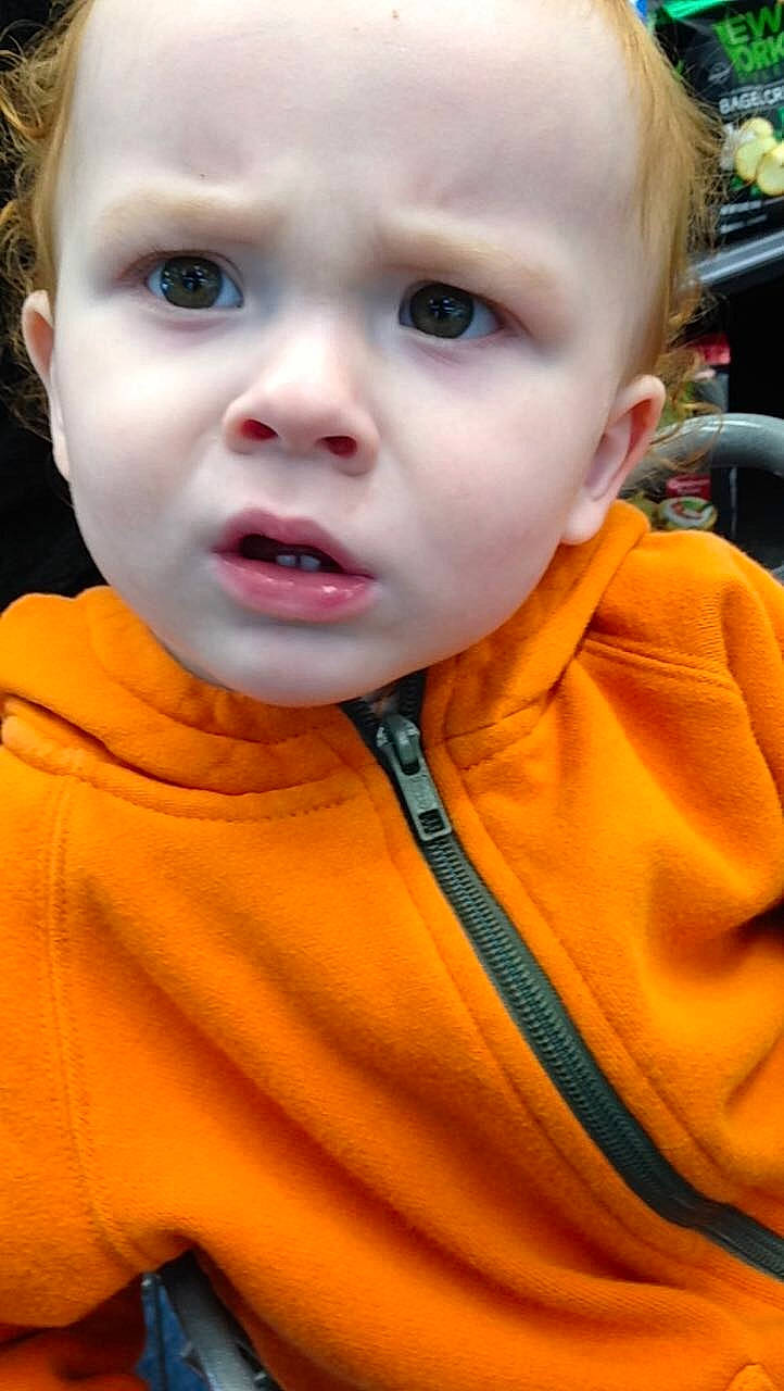 Elyie is registered to the contest to win money with this photo: baby, baby_toddler_clothing, cheek, child, ear, eyebrow, eyelash, forehead, fun, happy, iris, lip, mouth, nose, orange, person, skin, sleeve, smile, sorrow