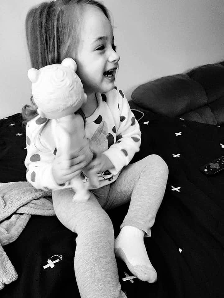 Mia is registered to the contest to win money with this photo: baby, black, black_and_white, child, comfort, elbow, eye, flash_photography, gesture, happy, human_leg, knee, monochrome, monochrome_photography, person, room, sitting, smile, style, toddler