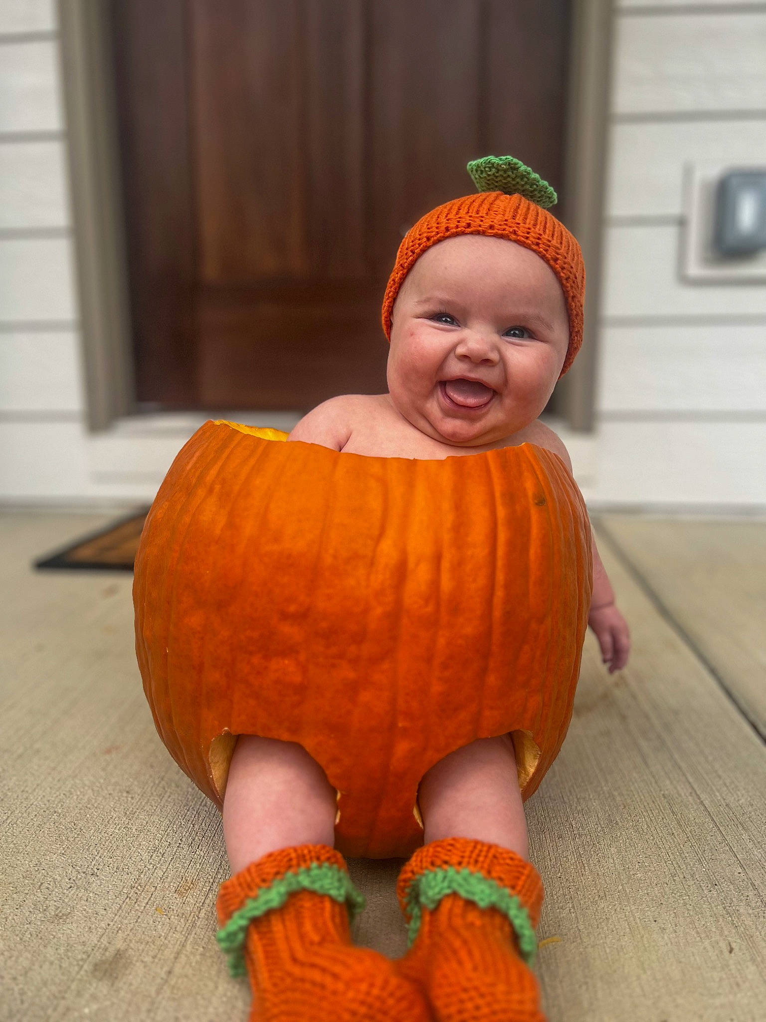 Alexandra joined the competition — help win amazing prizes! art, baby, baby_toddler_clothing, calabaza, comfort, cucurbita, door, eye, floor, flooring, gourd, headwear, jack_o_lantern, joy, orange, person, pumpkin, smile, squash, toddler