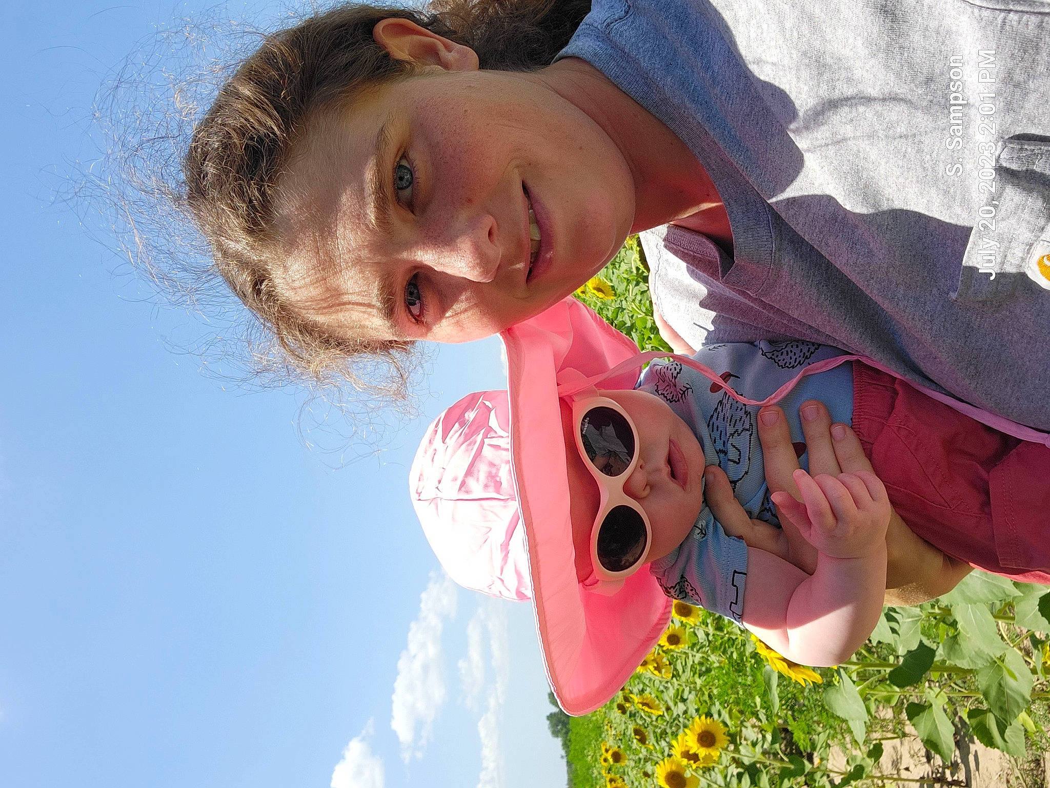 Hannah joined the competition — help win amazing prizes! adventure, carmine, child, face, fun, grass, happy, hat, head, joy, leisure, people_in_nature, person, personal_protective_equipment, plant, recreation, sky, smile, toddler, window