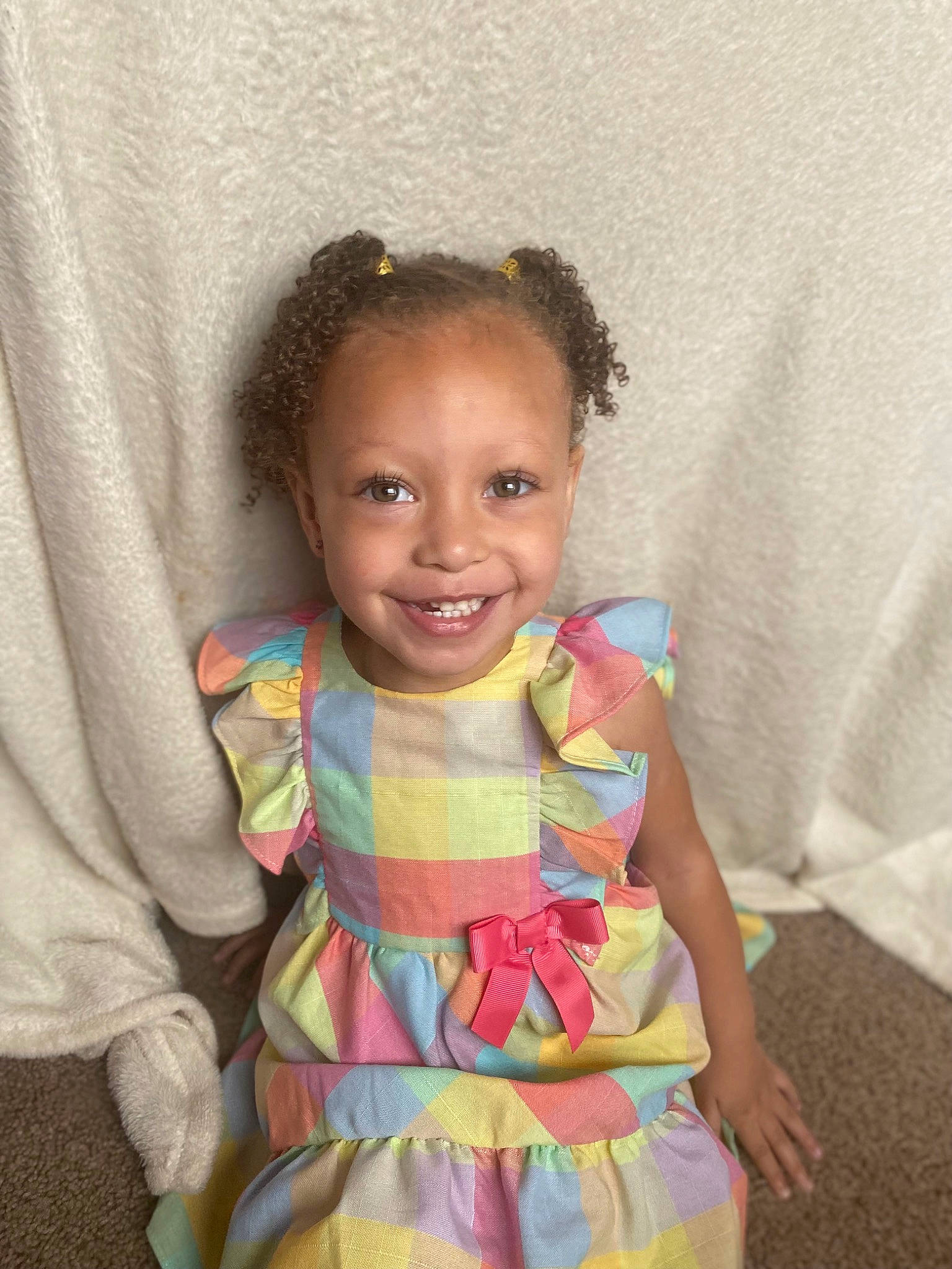 Londyn is registered to the contest to win money with this photo: arm, baby_toddler_clothing, beauty, cheek, chin, day_dress, dress, eye, face, facial_expression, fun, happy, human_body, joy, neck, person, pink, skin, sleeve, smile
