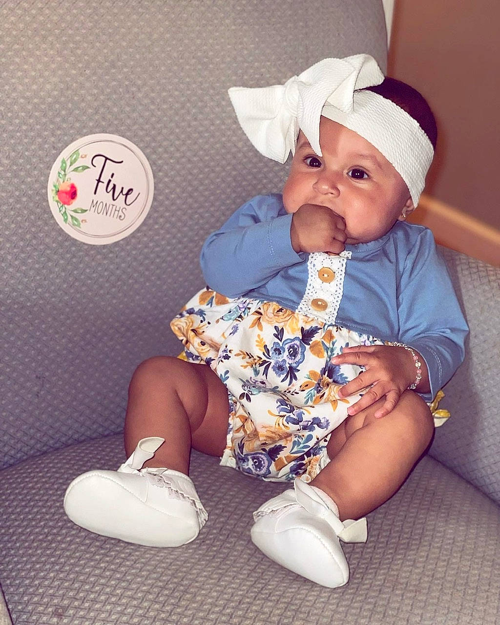 Addilyn is registered to the contest to win money with this photo: baby, baby_sleeping, baby_toddler_clothing, cap, child, comfort, happy, hat, headwear, knee, lap, leg, person, pink, purple, shoe, sitting, sleeve, sock, textile