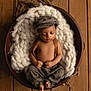 Kylo joined the competition — help win amazing prizes! baby, sleeping, basket, knit_blanket, plaid_pants, newsboy_cap, wooden_floor, cozy, infant, child, peaceful, cute, indoors, portrait, resting, soft_texture, fashion, hands, feet, relaxing