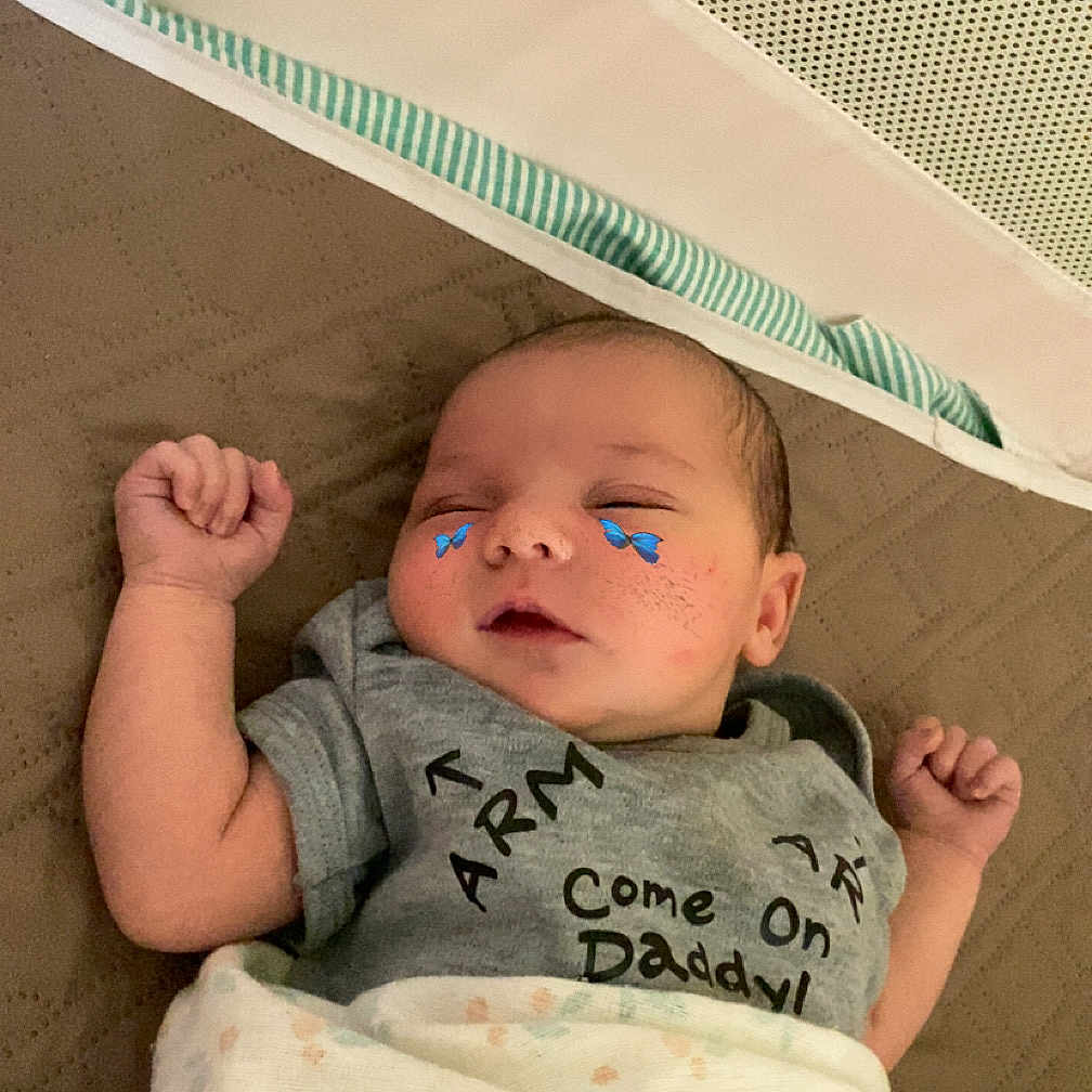 Madison joined the competition — help win amazing prizes! arm, baby, blanket, butterfly_stickers, cheeks, child, closeup, clothing, cute, face, floral_pattern, gray_shirt, hand, indoors, infant, lying_down, peaceful, quilted, sleeping, soft