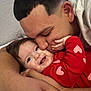 Valentina is registered to the contest to win money with this photo: baby, man, hug, kiss, smile, love, affection, red_clothing, heart_pattern, closeup, face, skin, arm, hand, wall, indoor, happy, family, toddler, parent