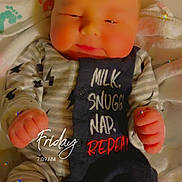 Ryder is registered to the contest to win money with this photo: baby, bed, blanket, bodypart, bonnet, clothing, couch, crib, cushion, doll, dress, face, finger, furniture, glove, hand, hat, head, homedecor, infantbed