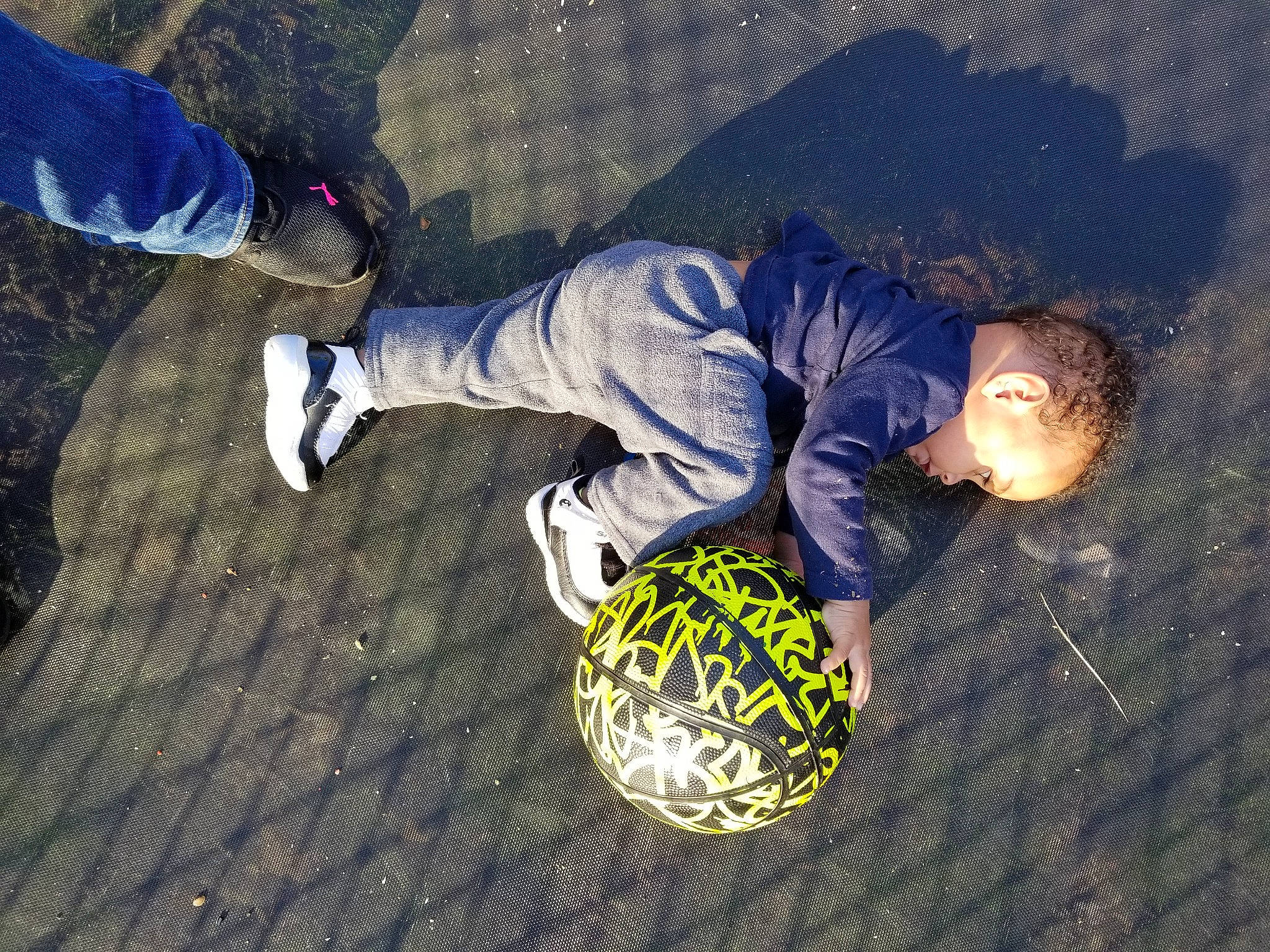 Lukah is registered to the contest to win money with this photo: circle, cool, darkness, denim, electric_blue, flash_photography, flooring, fun, grass, human_leg, night, pattern, person, shadow, sitting, sneakers, space, sportswear, visual_arts, walking_shoe