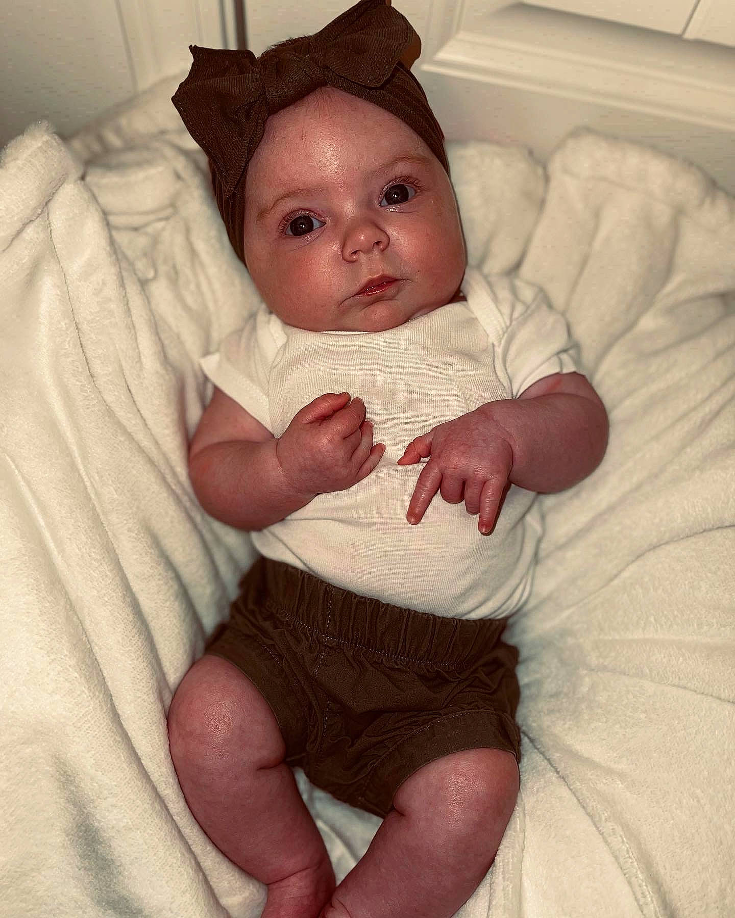 Paisley is registered to the contest to win money with this photo: arm, baby, baby_sleeping, baby_toddler_clothing, cheek, child, comfort, eye, face, hand, human_body, human_leg, knee, mammal, person, skin, sleeve, sock, thigh, toddler