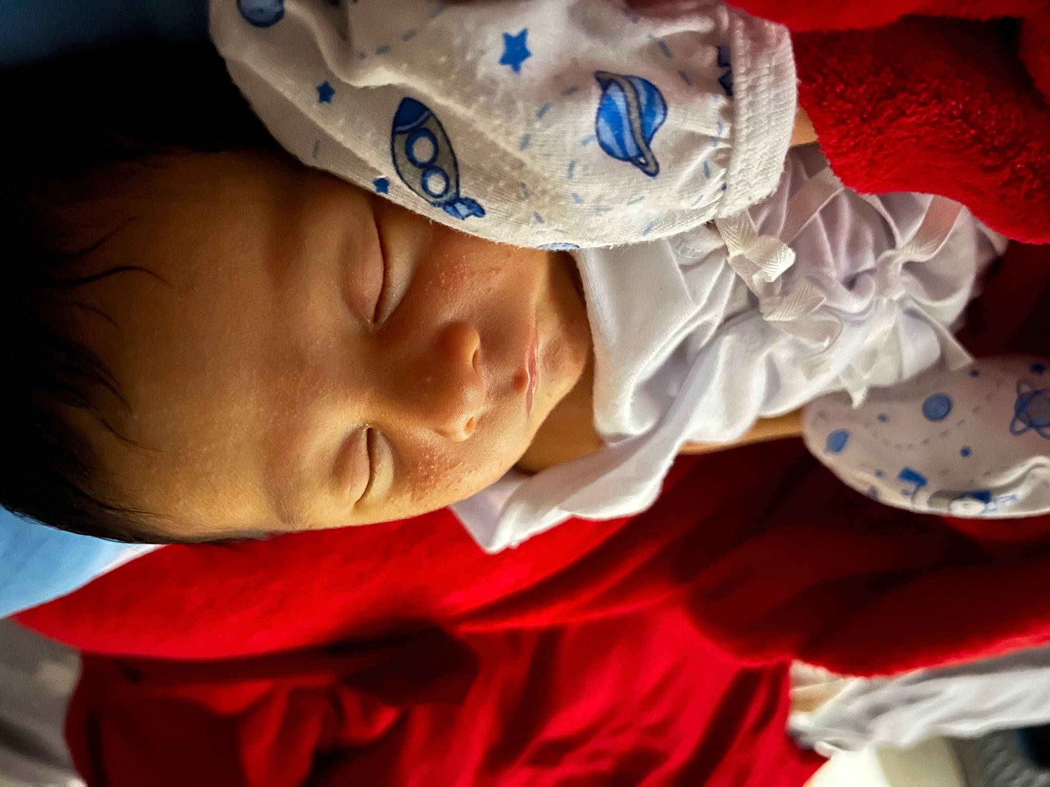 Yeshua is registered to the contest to win money with this photo: baby, baby_products, baby_toddler_clothing, bedtime, carmine, cheek, child, close_up, comfort, electric_blue, fashion_accessory, fun, happy, lip, mouth, nose, person, play, portrait_photography, smile