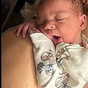 Amber is registered to the contest to win money with this photo: animal_print, baby, child, closeup, cozy, cute, face, hand, indoor, infant, newborn, onesie, peaceful, person, resting, shoulder, skin, sleeping, soft_lighting, yawning