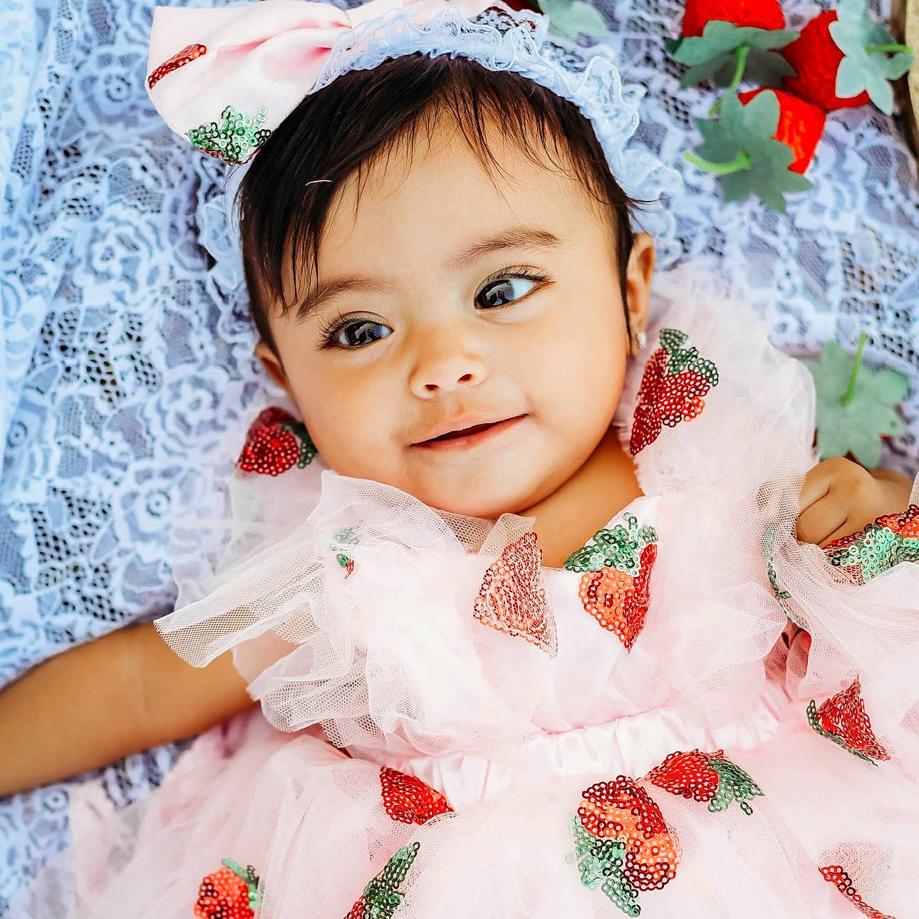 Eliana is registered to the contest to win money with this photo: adorable, baby, blanket, bow, child, closeup, cute, dress, face, fashion, happy, headband, infant, lace, pink, portrait, sequins, smile, strawberry, toddler