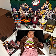 Celine joined the competition — help win amazing prizes! baby, cosplay, demon_slayer, anime, figurines, collectibles, poster, sword_cups, black_pillow, table, toy, box, child, costume, fan_art, indoor, person, merchandise, cute, pink_outfit