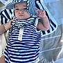 Evan participe au concours pour gagner de l'argent avec cette photo : baby, blanket, blue, casual, child, cute, fashion, hat, infant, one_person, outdoor, person, portrait, resting, striped_blanket, striped_clothing, striped_hat, summer, white, young_child