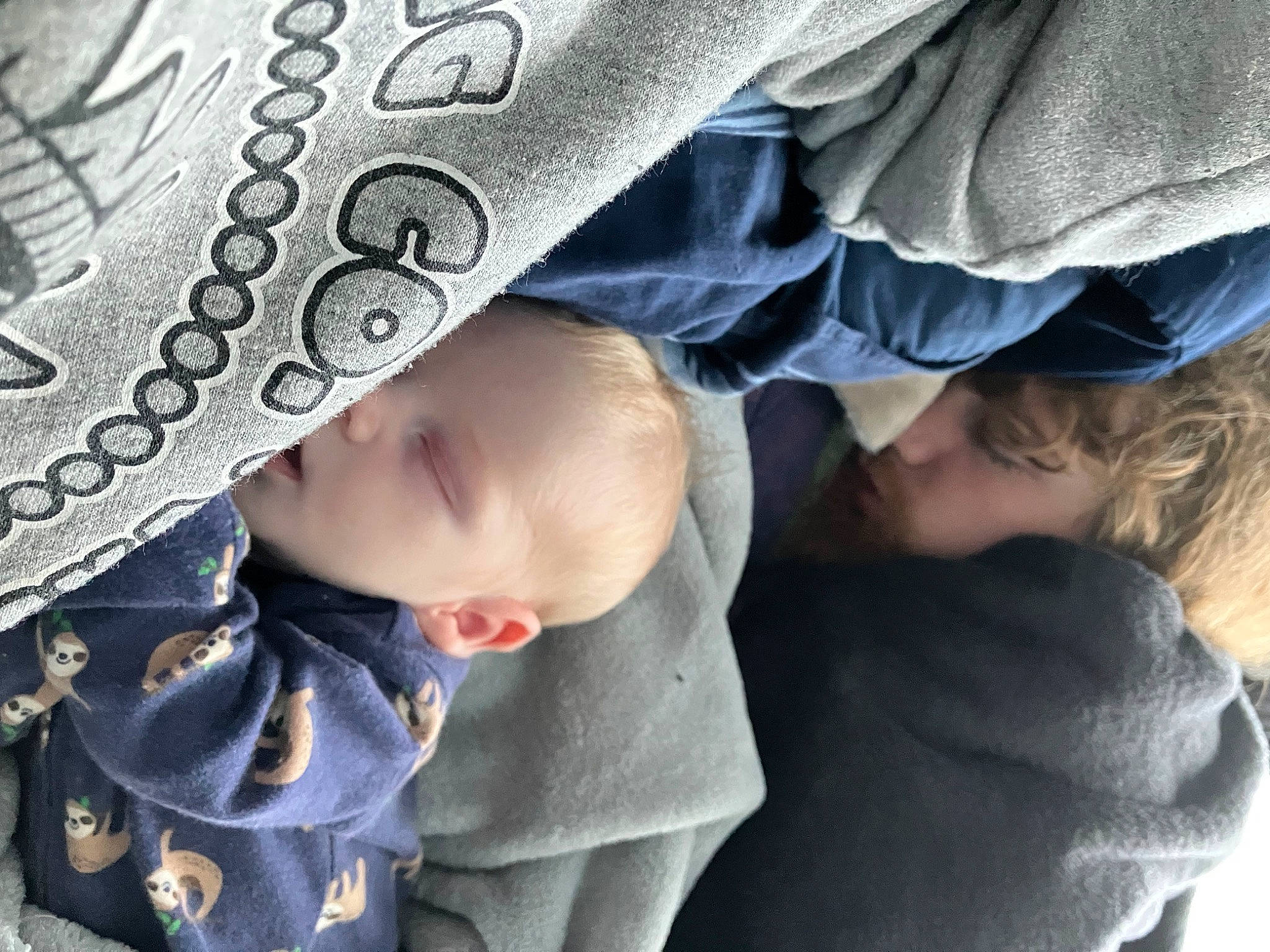 Kimi is registered to the contest to win money with this photo: art, baby, baby_products, baby_toddler_clothing, cheek, child, comfort, eye, face, facial_expression, fashion_accessory, gesture, happy, head, mouth, pattern, person, sitting, skin, toddler