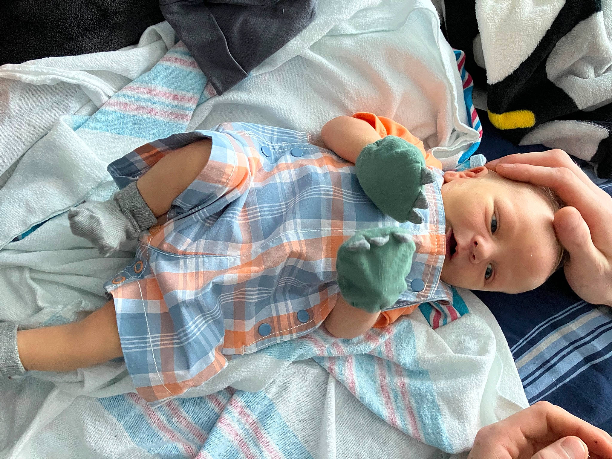 Kimi is registered to the contest to win money with this photo: baby, baby_products, baby_toddler_clothing, child, comfort, eyelash, linens, pattern, person, plaid, product, room, sitting, sleep, sleeve, t_shirt, tartan, textile, toddler, toy