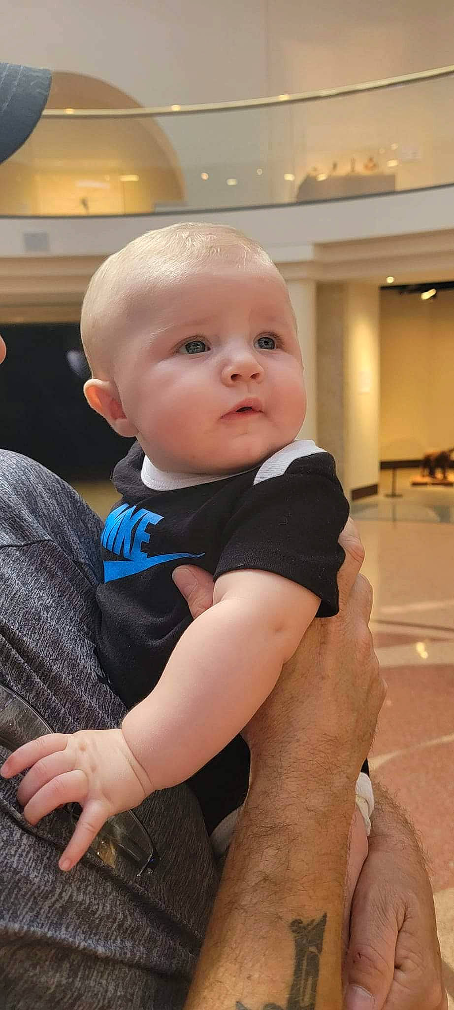 Kane is registered to the contest to win money with this photo: abdomen, baby, baby_toddler_clothing, cheek, chest, child, chin, comfort, elbow, electric_blue, eye, flooring, fun, happy, knee, person, skin, sleeve, stomach, toddler