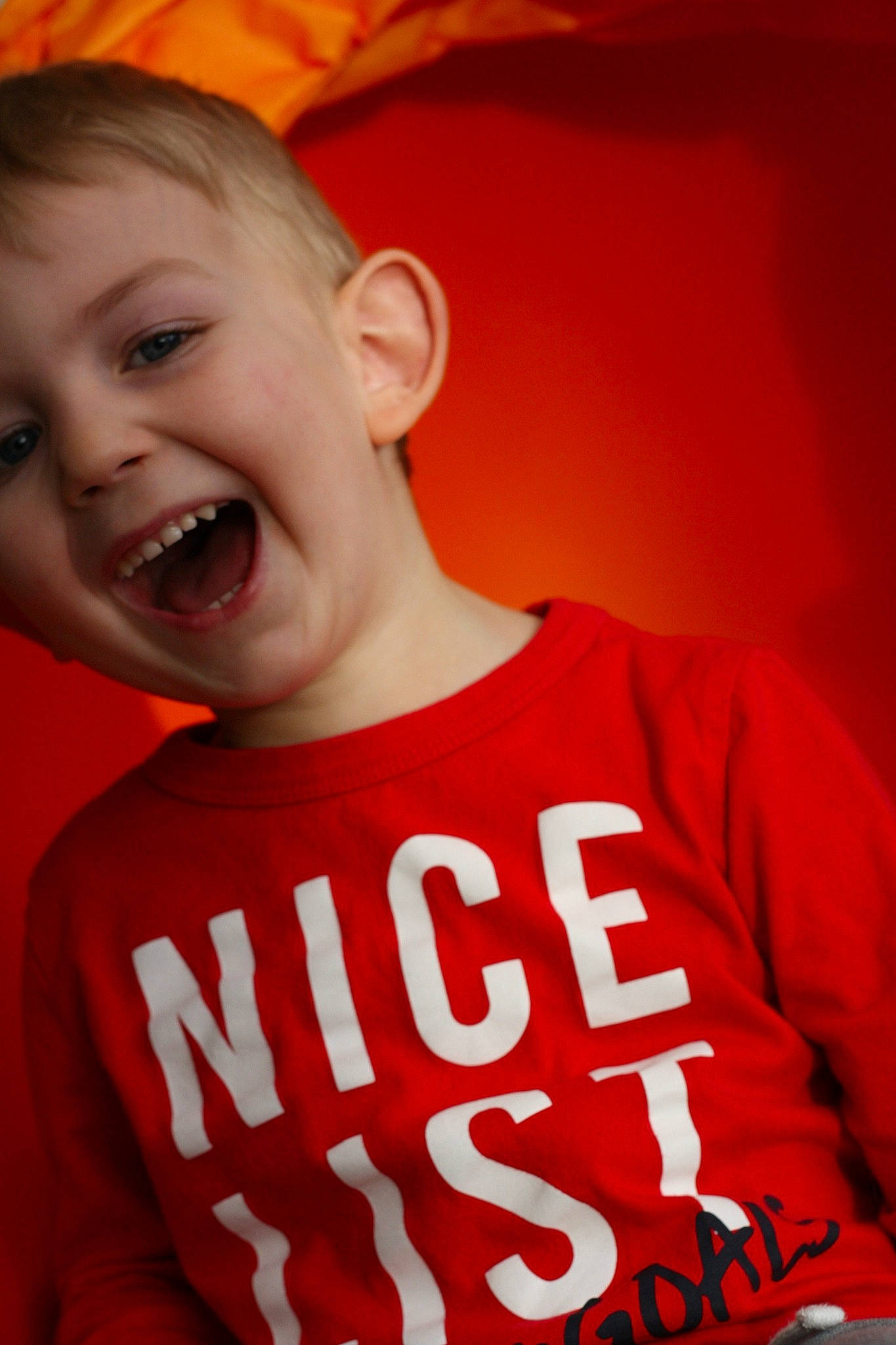 Heath is registered to the contest to win money with this photo: child, cool, facial_expression, happy, joy, laugh, lip, mouth, person, red, smile, t_shirt