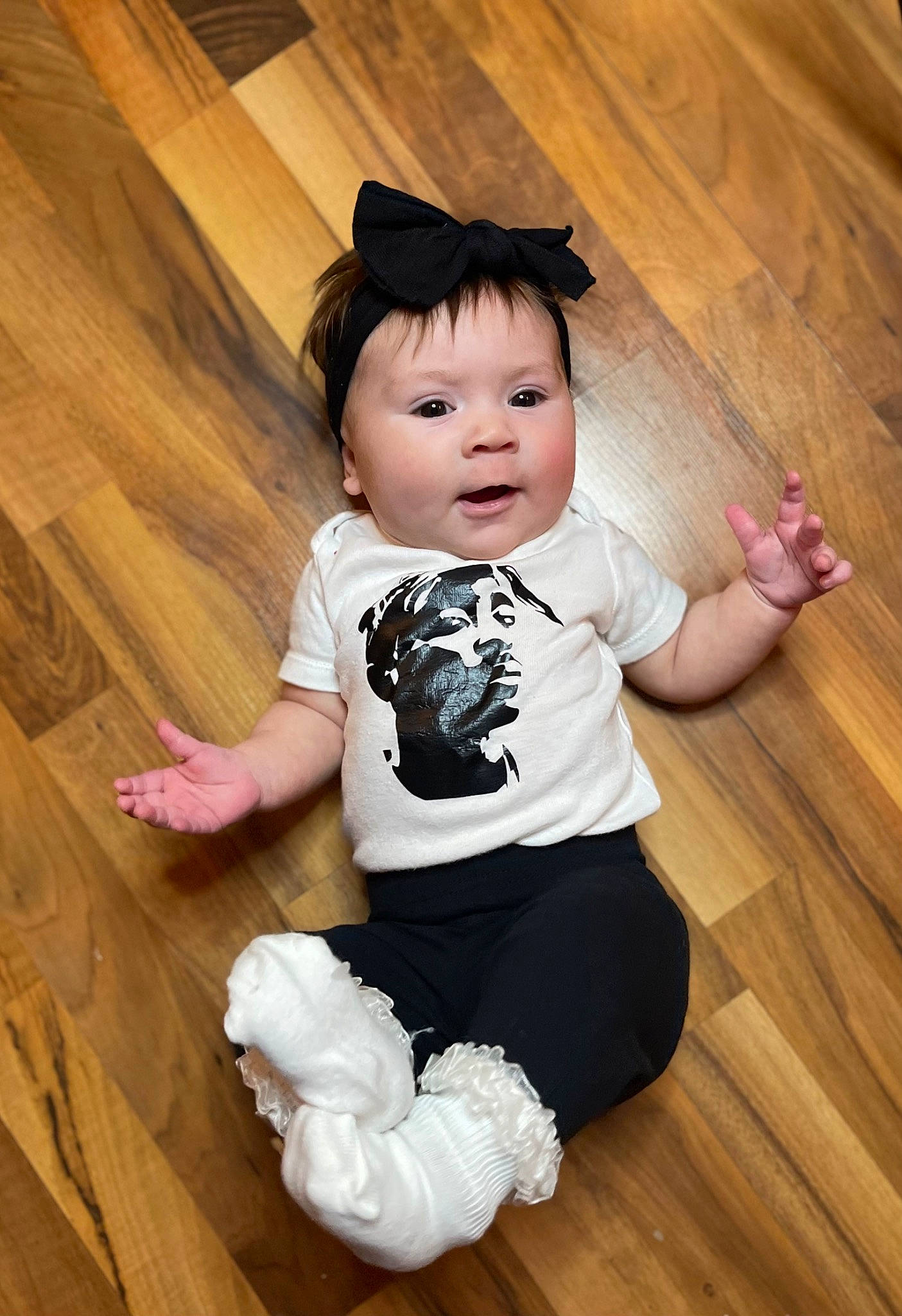 Blakely is registered to the contest to win money with this photo: baby_toddler_clothing, beauty, cheek, child, eye, flash_photography, floor, flooring, fun, happy, hardwood, laminate_flooring, person, pink, skin, sleeve, standing, t_shirt, toddler, white
