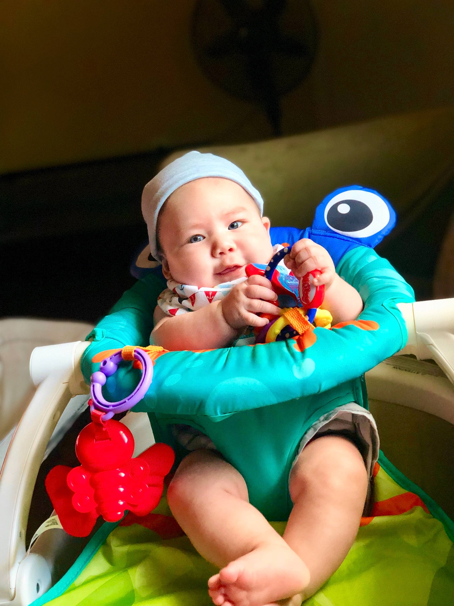 Calel is registered to the contest to win money with this photo: arm, baby, baby_playing_with_toys, baby_products, baby_toys, child, ear, eye, finger, fun, head, headgear, headwear, mouth, person, play, product, sitting, skin, snapshot