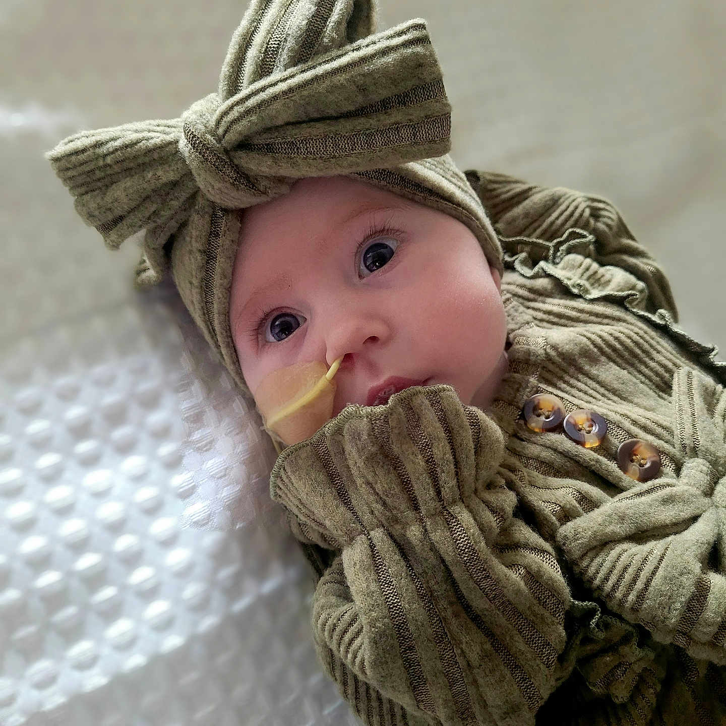 Grace joined the competition — help win amazing prizes! baby, beanie, bodypart, bonnet, cap, clothing, face, finger, glove, hand, hat, head, hood, hoodie, knitwear, person, photography, portrait, sweater, sweatshirt
