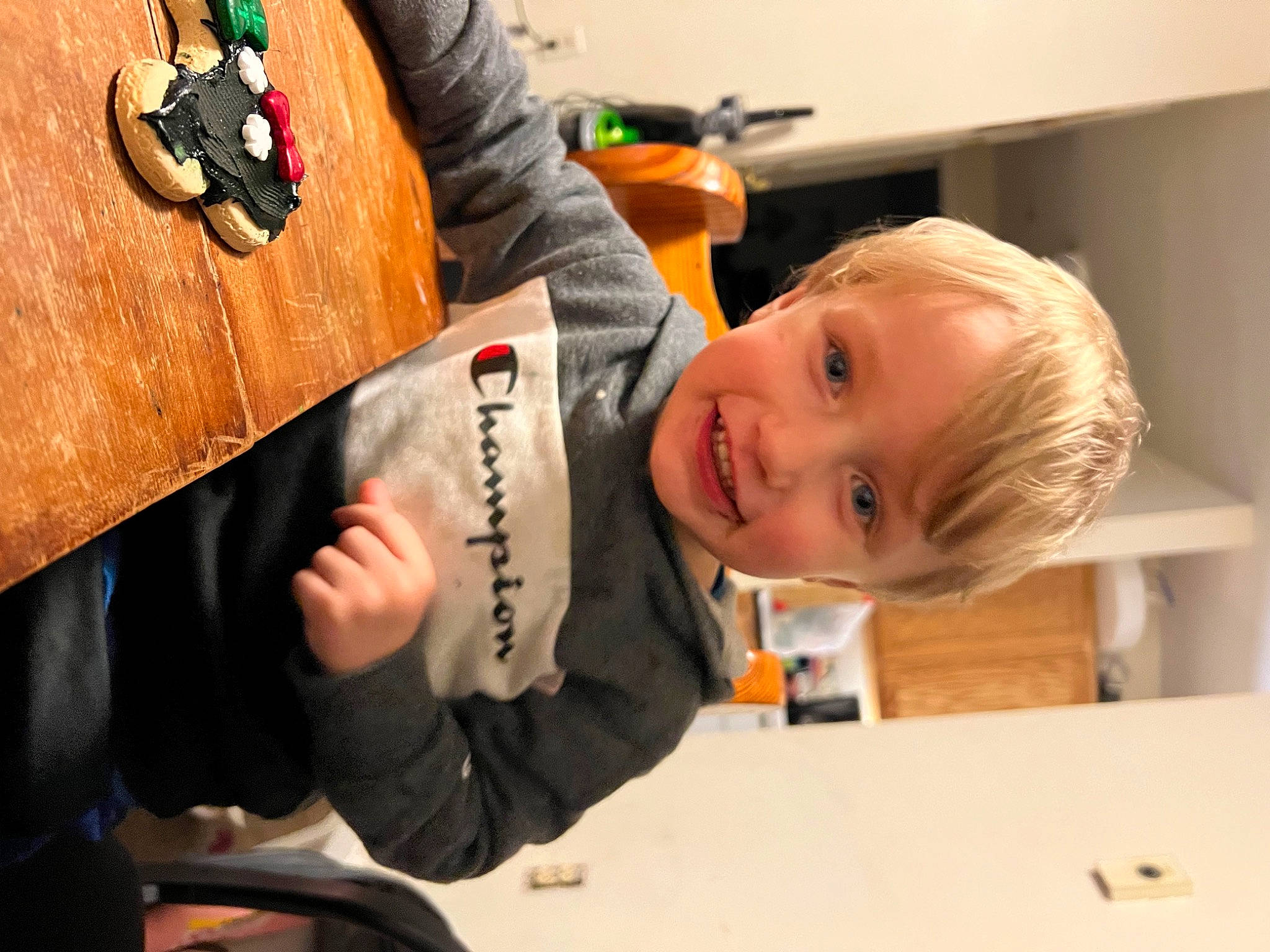 Levi joined the competition — help win amazing prizes! baby, baby_products, chair, child, facial_expression, finger, fun, gesture, hairstyle, happy, joy, person, play, room, sitting, smile, suit, t_shirt, table, toddler