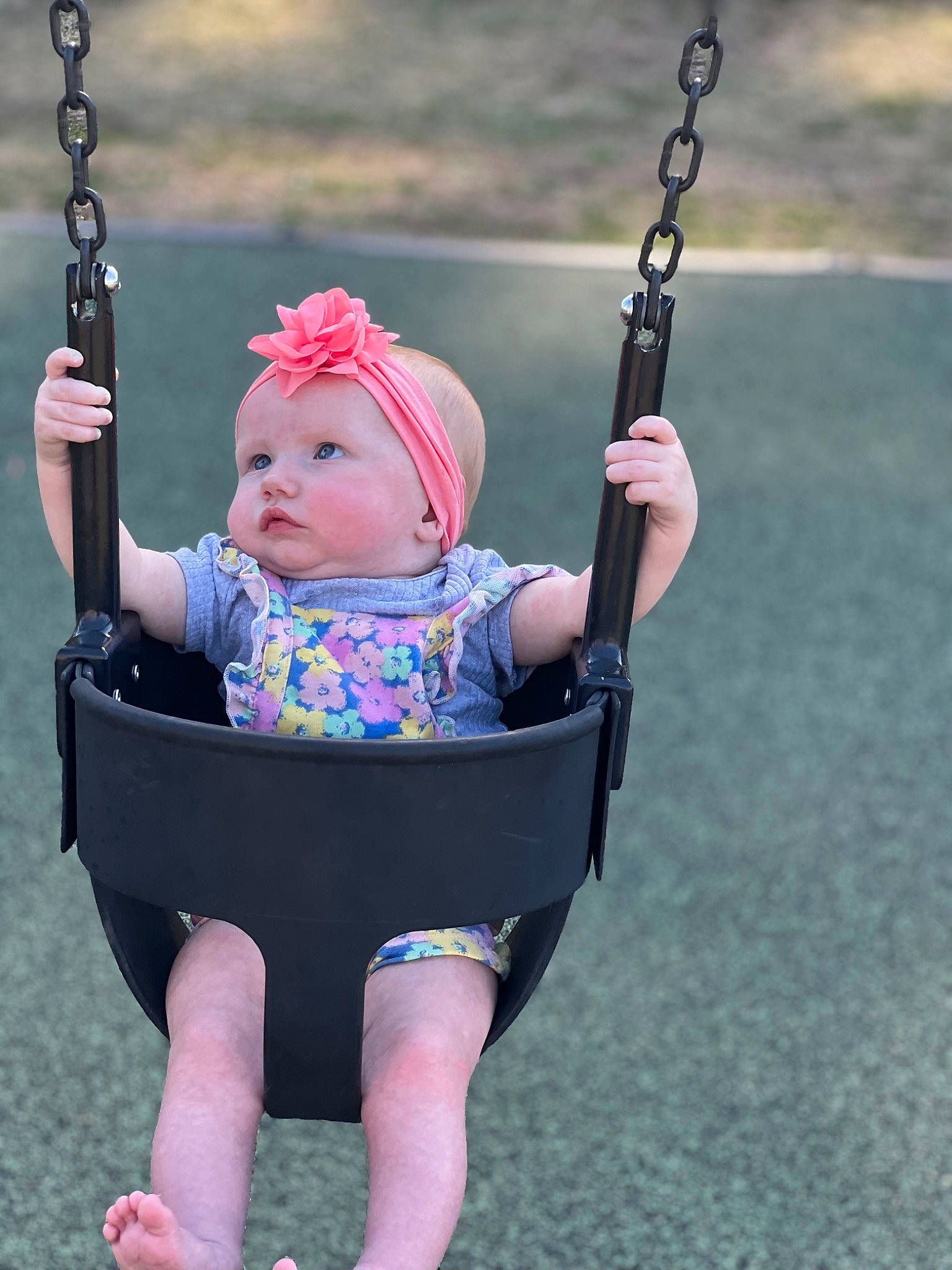 Esmae is registered to the contest to win money with this photo: baby, baby_carriage, baby_toddler_clothing, child, city, face, fun, grass, happy, headwear, leisure, person, pink, plant, play, playground, recreation, summer, swing, toddler