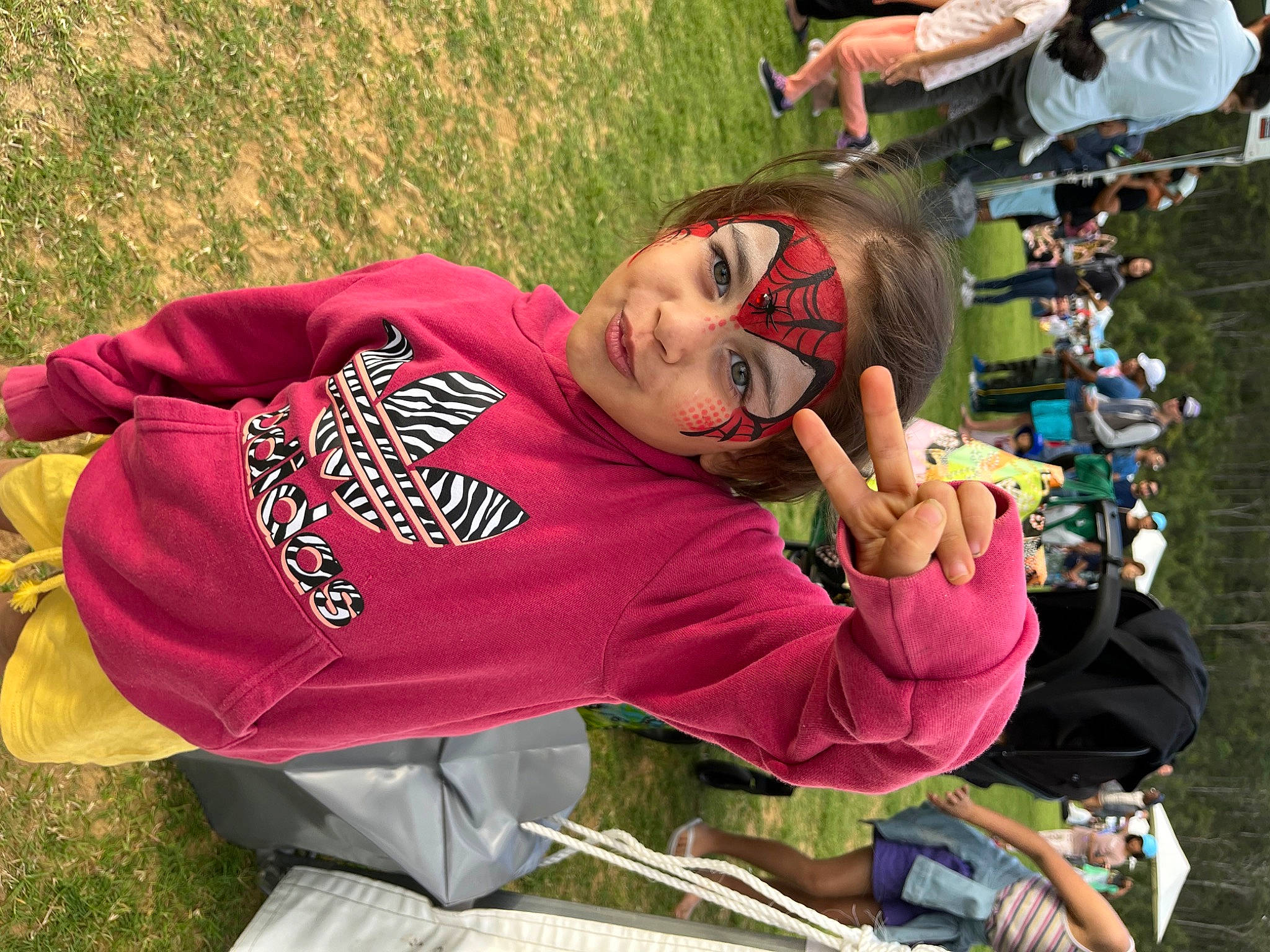 Aylah joined the competition — help win amazing prizes! chair, child, competition_event, event, fun, grass, grassland, happy, headwear, leisure, person, recreation, sitting, t_shirt, team