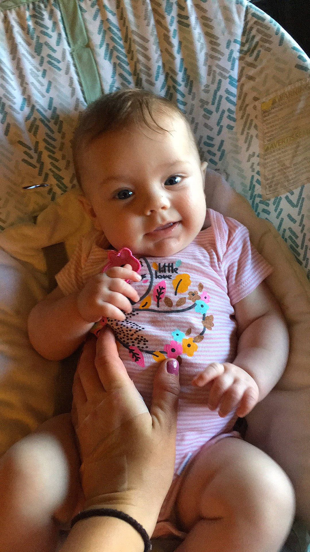 Charlette is registered to the contest to win money with this photo: baby, baby_toddler_clothing, cheek, child, eye, face, finger, hand, happy, head, iris, mouth, nail, nose, person, sitting, skin, smile, textile, thigh