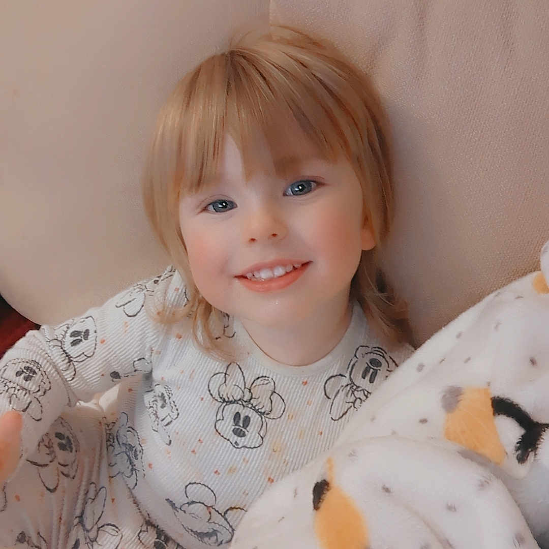 Eliana-Jane joined the competition — help win amazing prizes! baby, bed, blanket, bodypart, clothing, couch, cushion, face, finger, furniture, hand, happy, head, homedecor, linen, pajamas, person, photography, portrait, smile