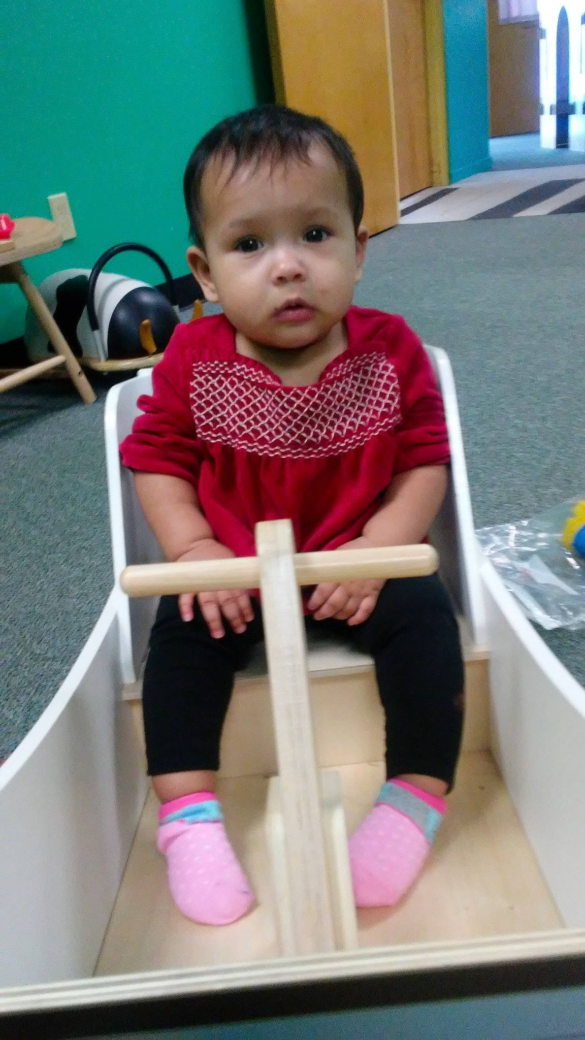 Kamiya is registered to the contest to win money with this photo: arm, baby_products, child, day, fun, furniture, girl, infant, leg, person, pink, play, product, sitting, skin, standing, textile, toddler