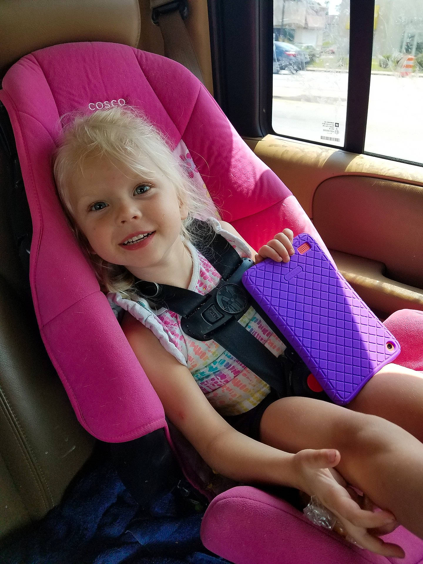 Alaina is registered to the contest to win money with this photo: beauty, blond, car_seat, child, day, fun, girl, hair, human_hair_color, infant, joy, leg, magenta, person, pink, product, purple, sitting, skin, smile