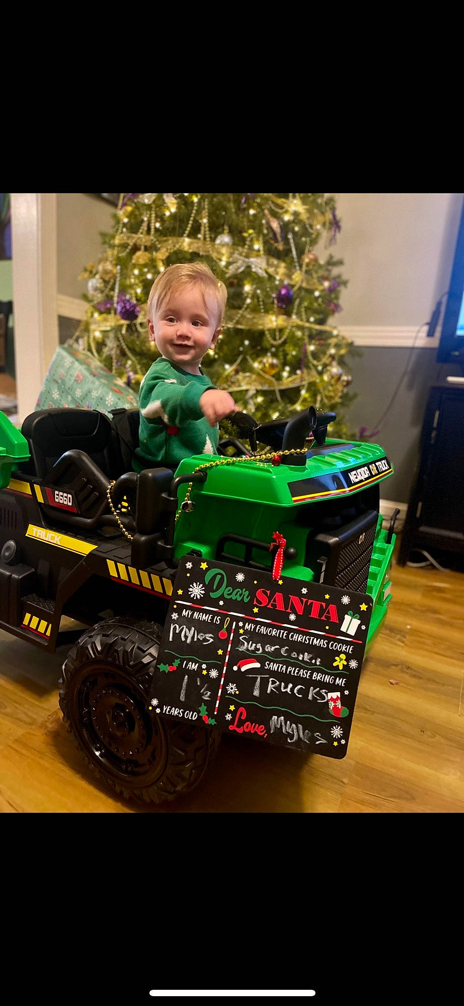 Myles joined the competition — help win amazing prizes! automotive_design, automotive_tire, baby, child, christmas_decoration, christmas_ornament, christmas_tree, event, fun, holiday, holiday_ornament, joy, motor_vehicle, person, plant, smile, tire, toddler, toy, tree