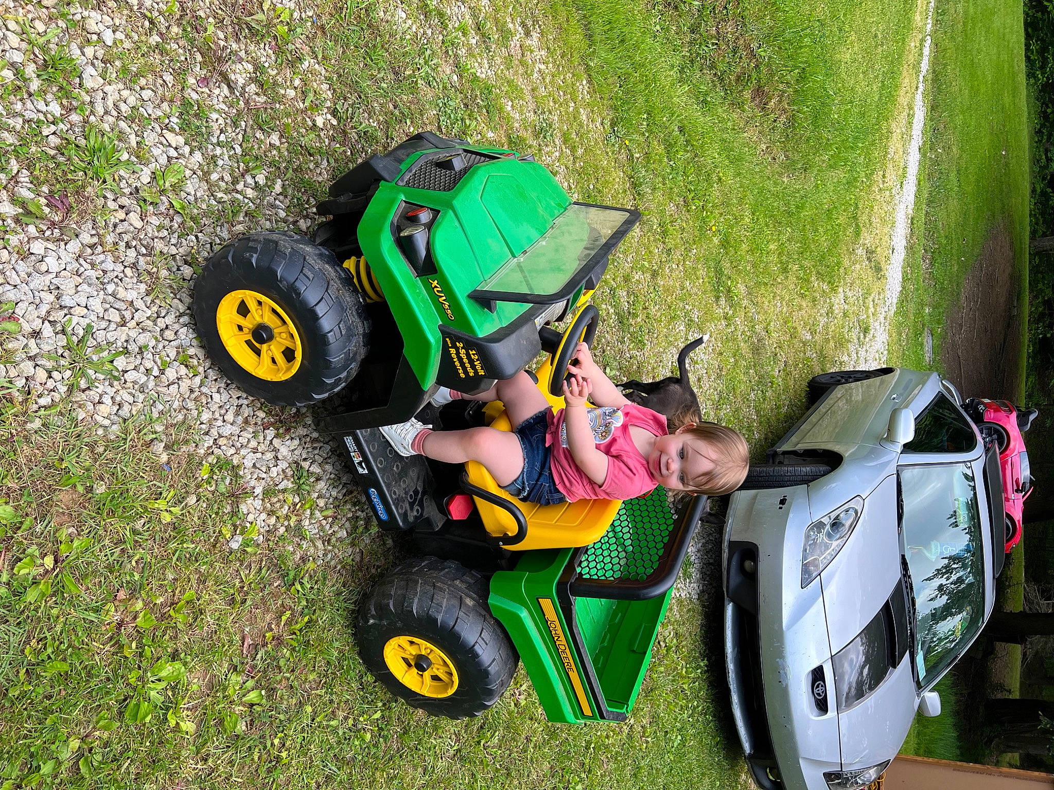 Ellarose joined the competition — help win amazing prizes! automotive_design, automotive_exterior, automotive_tire, automotive_wheel_system, bumper, fender, grass, grassland, green, joy, lawn, motor_vehicle, motorsport, outdoor_recreation, person, plant, recreation, tire, toddler, tread