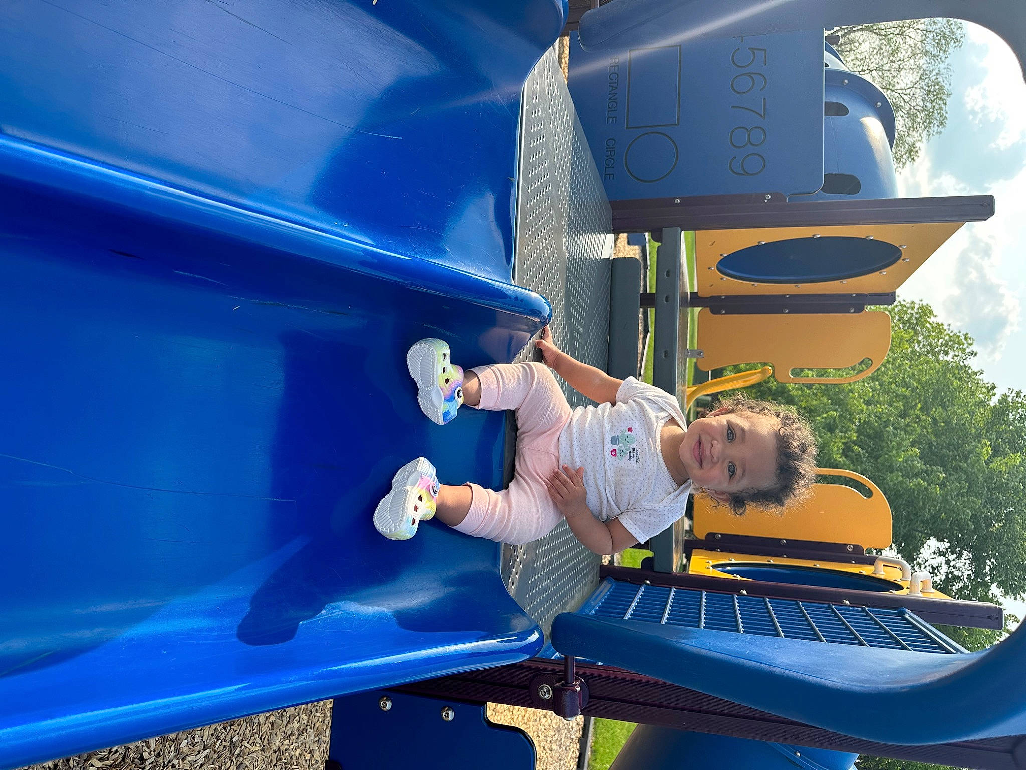 Kamiyah joined the competition — help win amazing prizes! automotive_exterior, blue, bumper, child, chute, city, cloud, electric_blue, fun, hood, joy, leisure, motor_vehicle, outdoor_play_equipment, person, playground, playground_slide, recreation, sky, snapshot