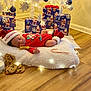 Eithan joined the competition — help win amazing prizes! baby, sleeping, christmas, holiday, presents, cookies, milk, candy_cane, red_clothing, hat, floor, wood_floor, fluffy_pillow, decorations, festive, indoor, child, toddler, sleep, cozy