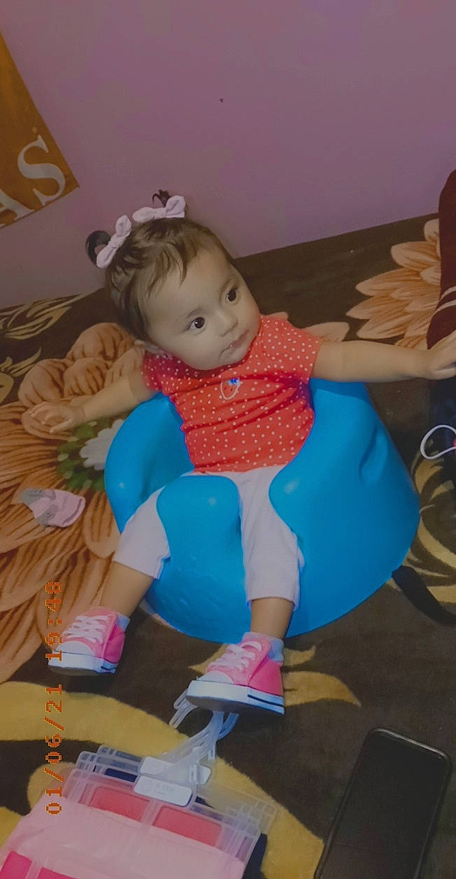 Neveah joined the competition — help win amazing prizes! baby, baby_products, baby_toddler_clothing, baby_toys, cheek, child, comfort, doll, event, fun, human_leg, lap, person, pink, room, sitting, skin, sock, stuffed_toy, toddler