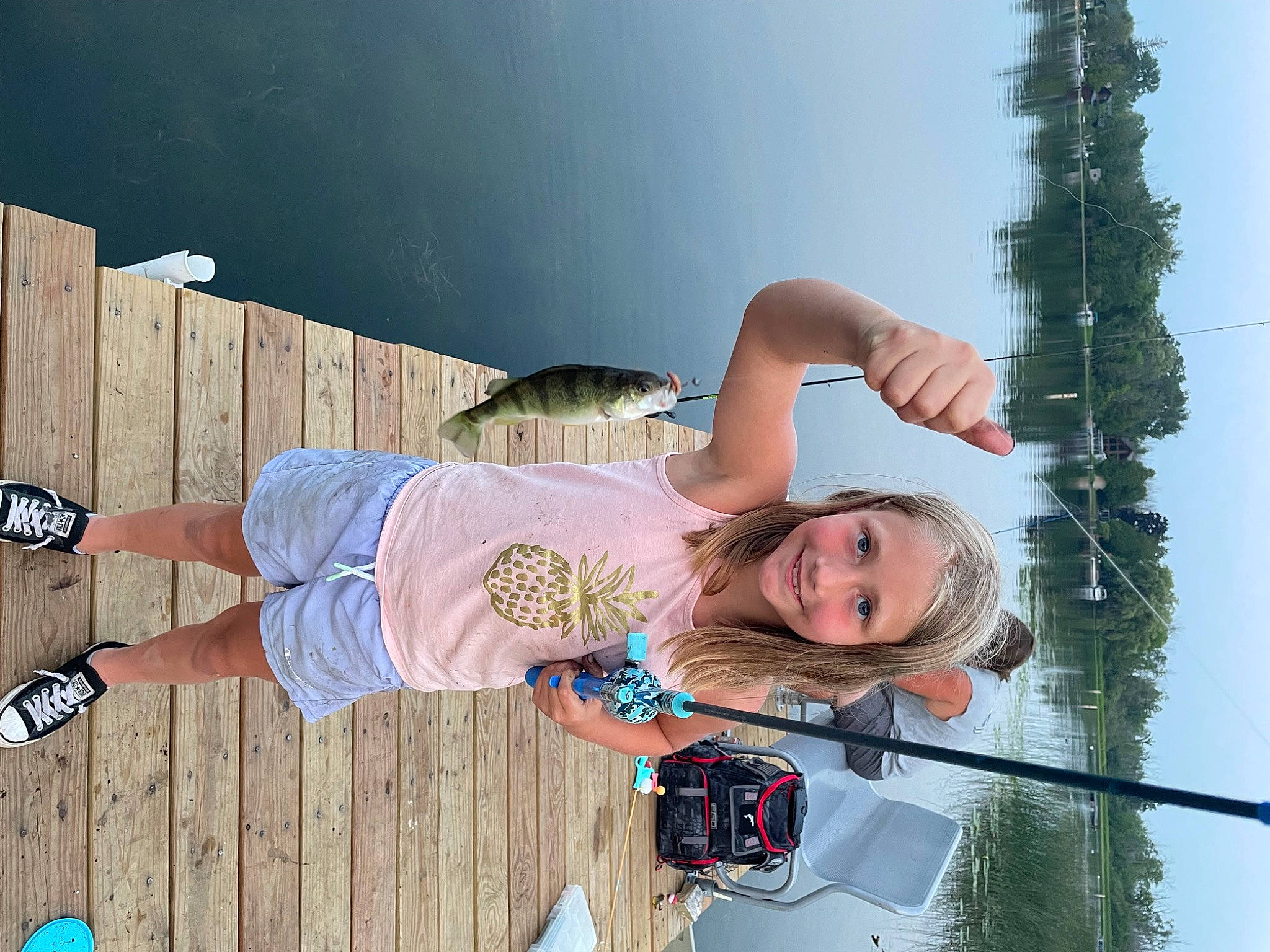 Peyton is registered to the contest to win money with this photo: car, elbow, fun, happy, human_leg, joy, knee, leisure, person, sky, smile, thigh, tree, vacation, walking_shoe, wood