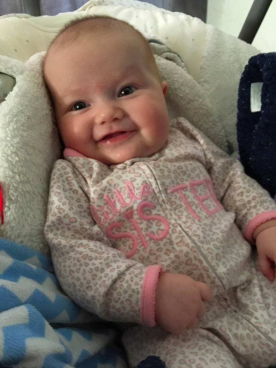 Julie is registered to the contest to win money with this photo: cheek, child, day, eye, finger, girl, head, infant, iris, knitting, lip, mouth, nose, person, product, skin, smile, textile, toddler