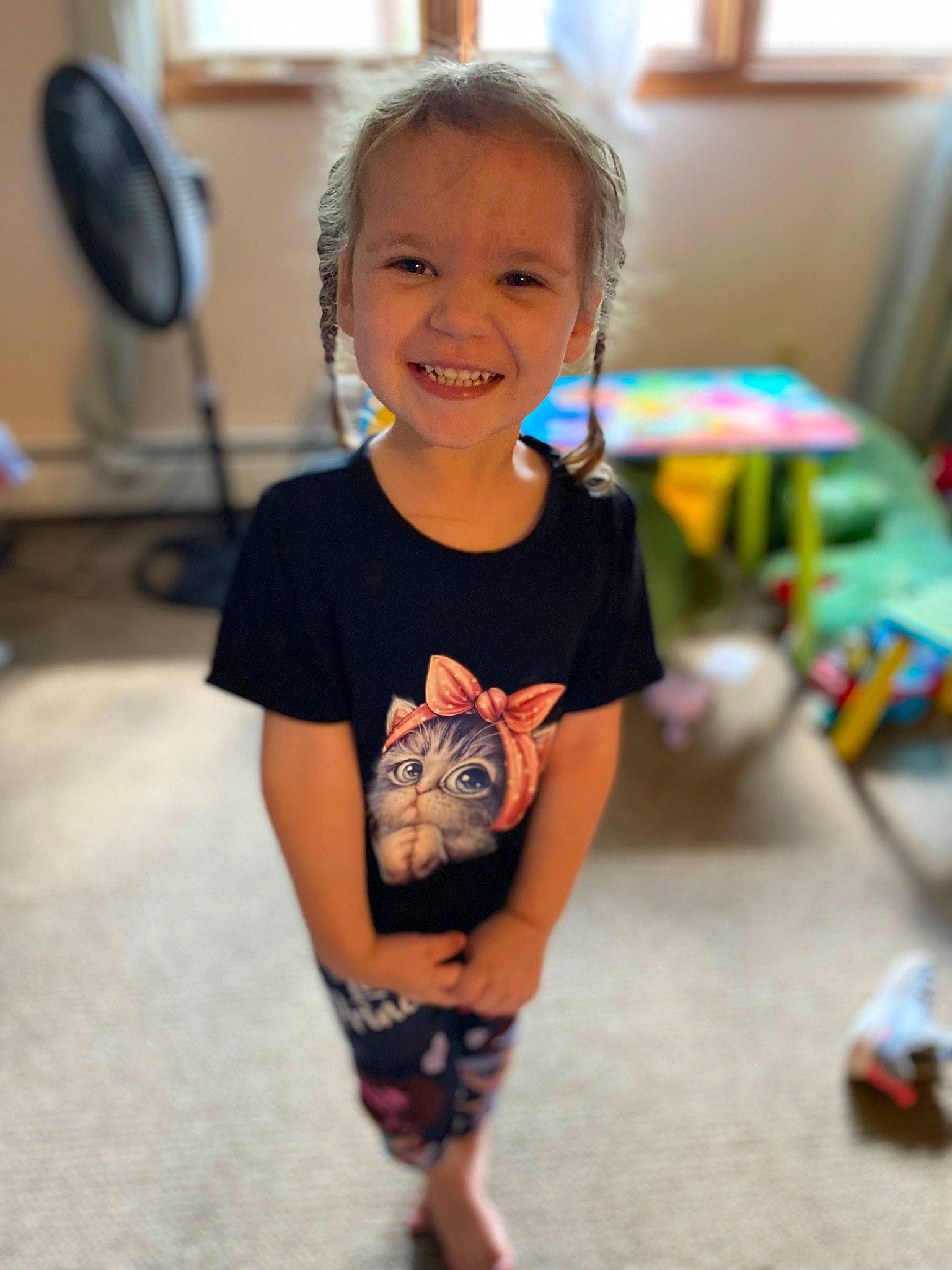 Kaylani joined the competition — help win amazing prizes! child, eye, face, flooring, fun, hairstyle, happy, head, human_leg, joy, leisure, person, play, recreation, sitting, skin, sleeve, smile, standing, t_shirt