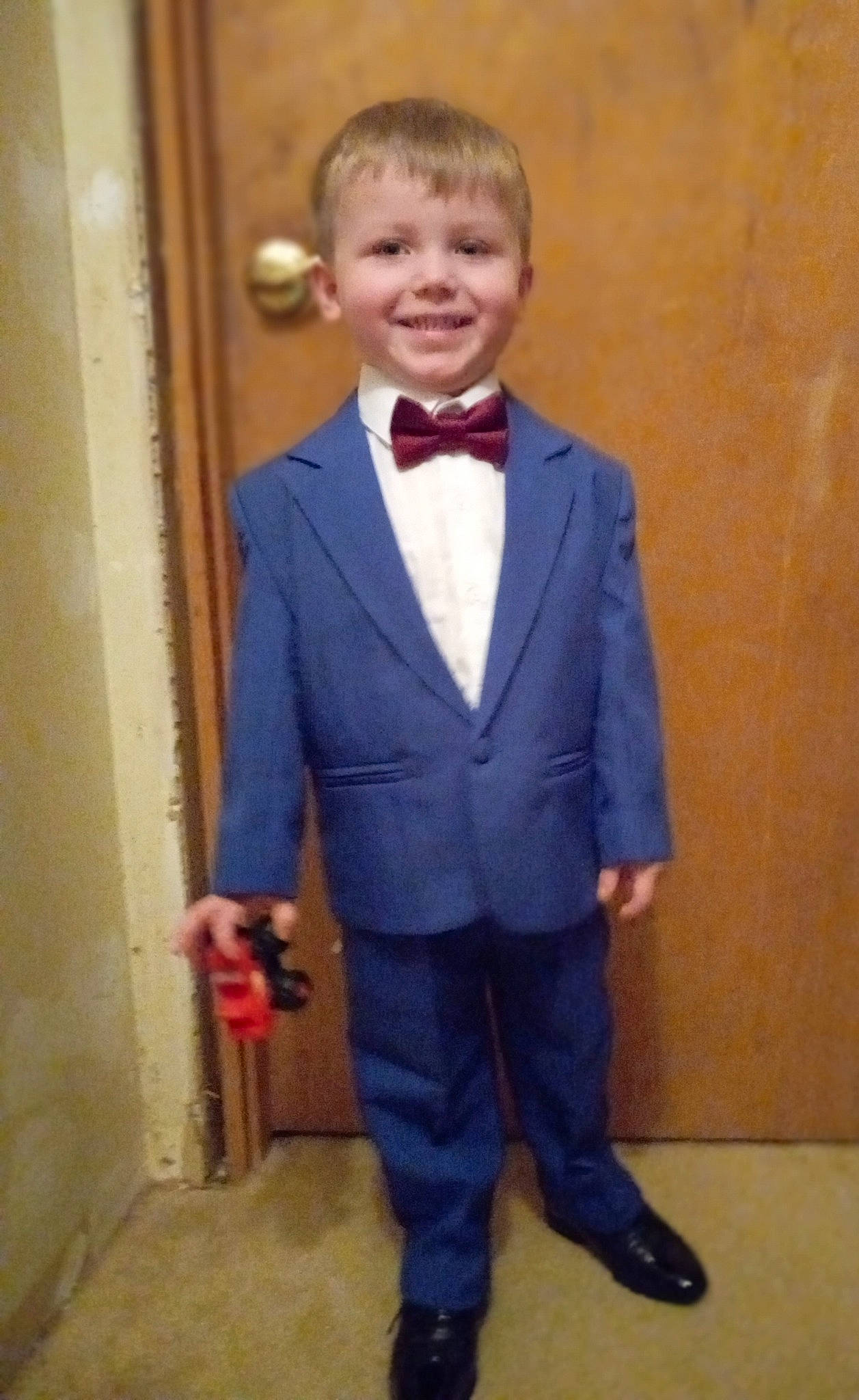 Devin joined the competition — help win amazing prizes! blazer, bow_tie, coat, collar, denim, door, dress_shirt, electric_blue, event, fashion_design, formal_wear, happy, joy, person, school_uniform, sleeve, smile, suit, tie, toddler