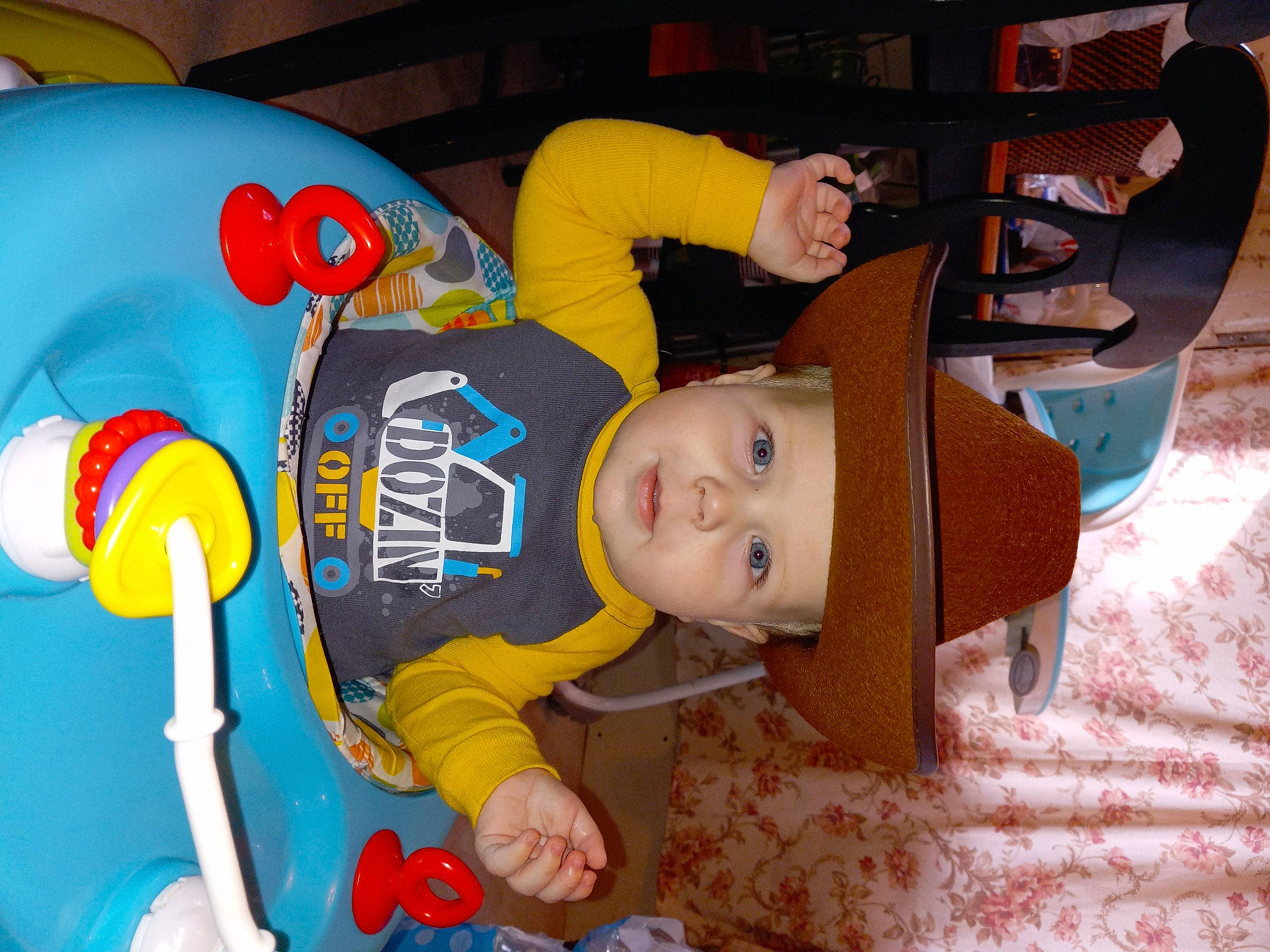 Conner is registered to the contest to win money with this photo: animation, baby, baby_products, baby_toddler_clothing, baby_toys, chair, child, comfort, fun, hat, headwear, leisure, person, play, recreation, room, t_shirt, toddler, toy, vacation