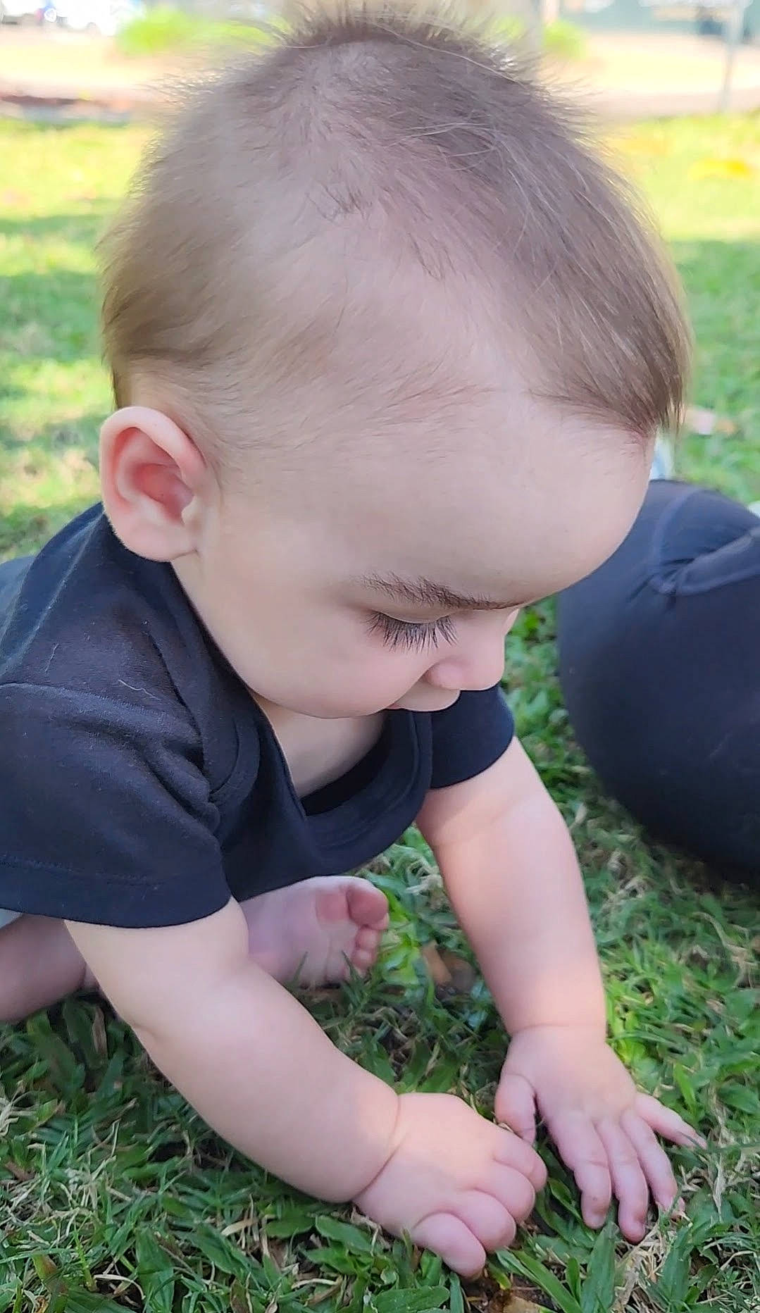 Reuben is registered to the contest to win money with this photo: baby_toddler_clothing, child, finger, fun, grass, grass_family, grassland, happy, lawn, leaf, mammal, people, people_in_nature, person, photograph, plant, shorts, skin, summer, toddler