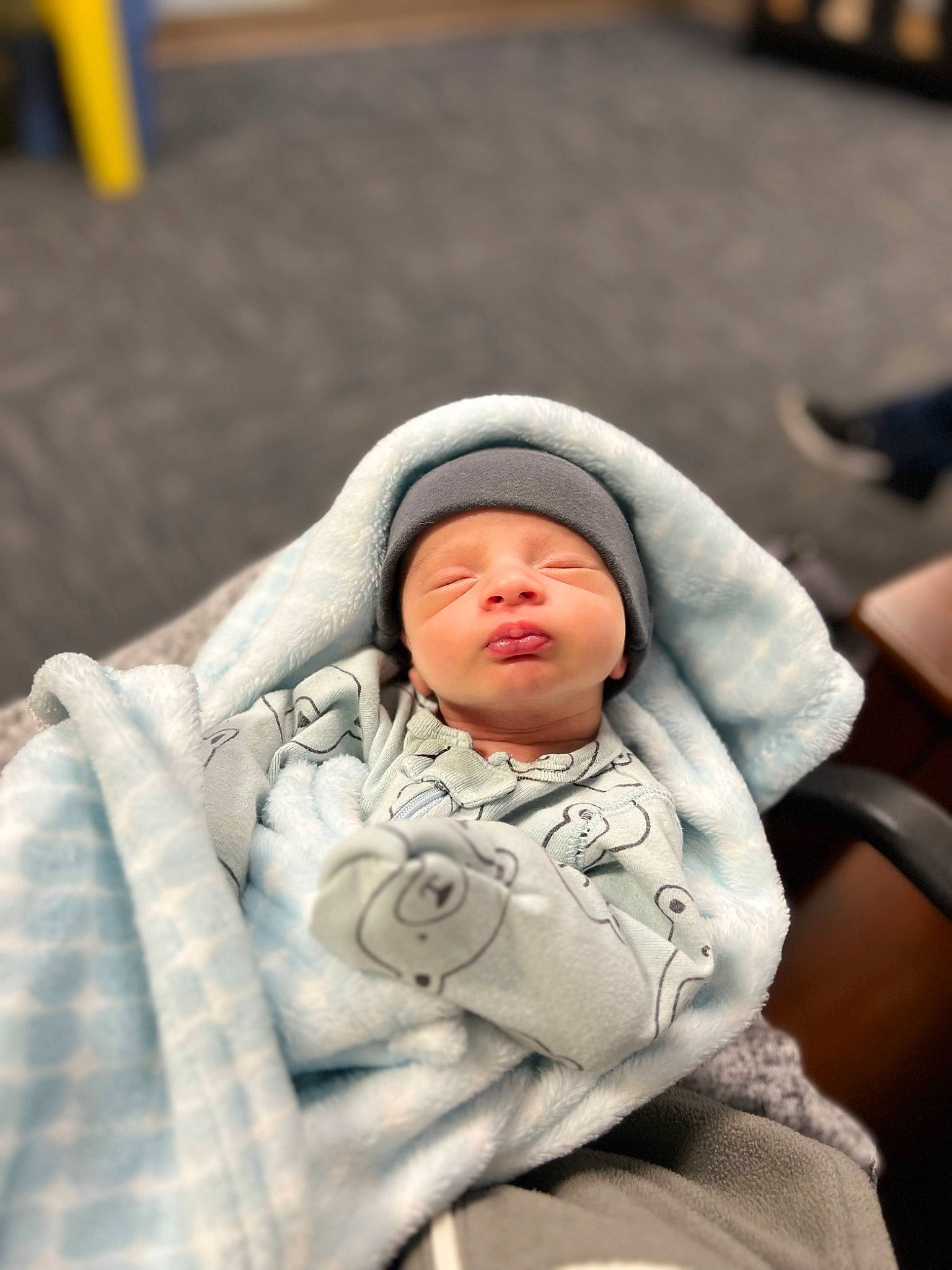 Jaxon is registered to the contest to win money with this photo: baby, child, comfort, event, headwear, linens, person, sitting, sleeve, toddler