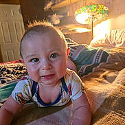 Greyson joined the competition — help win amazing prizes! baby, infant, bed, blanket, lamp, room, indoors, child, face, expression, clothing, comfort, lighting, cozy, furniture, person, skin, head, arm, eyes