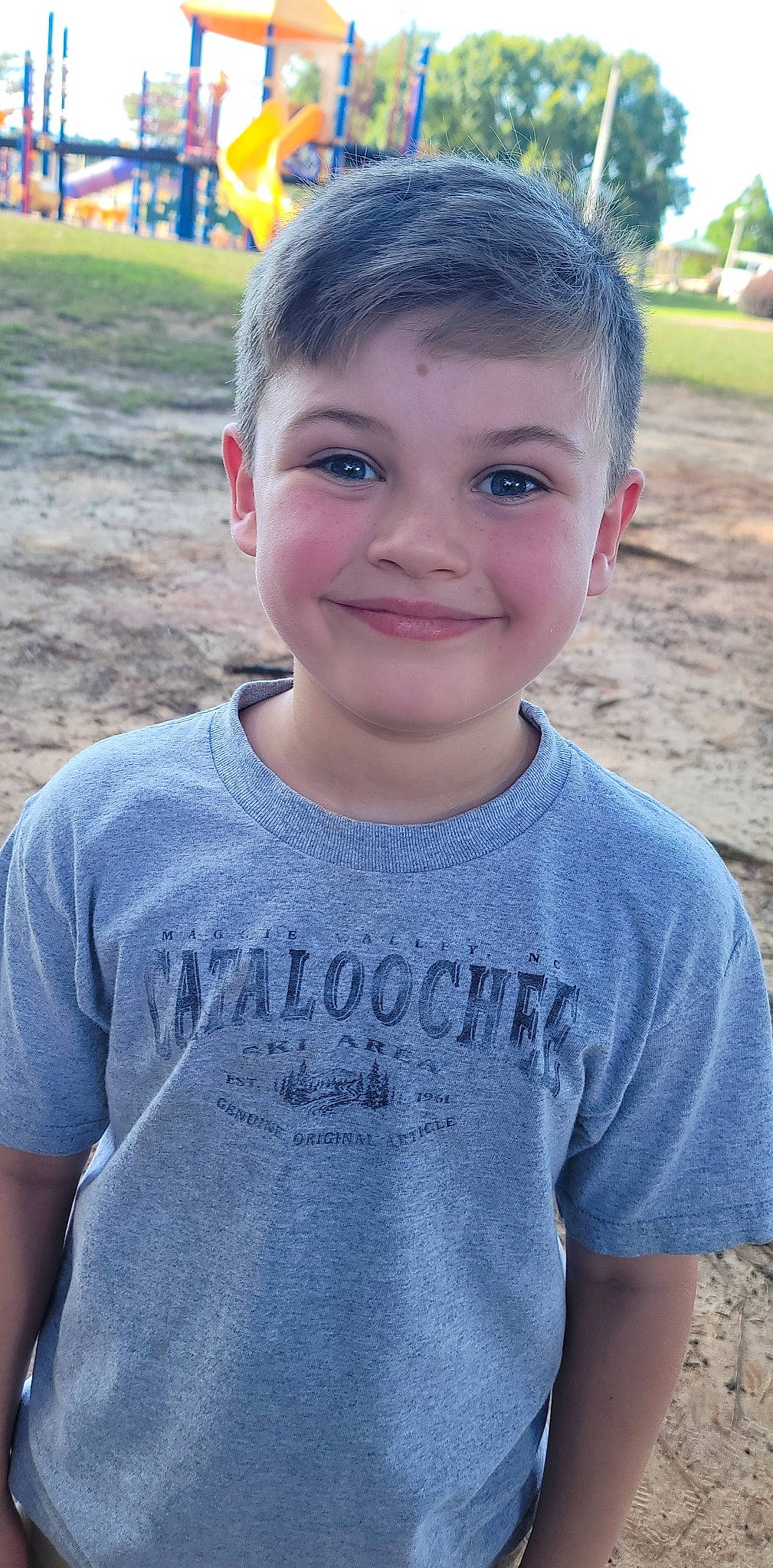 Mathew joined the competition — help win amazing prizes! blue, child, cool, electric_blue, facial_expression, forehead, fun, grass, happy, joy, leisure, neck, person, plant, sand, sleeve, smile, standing, t_shirt, toddler