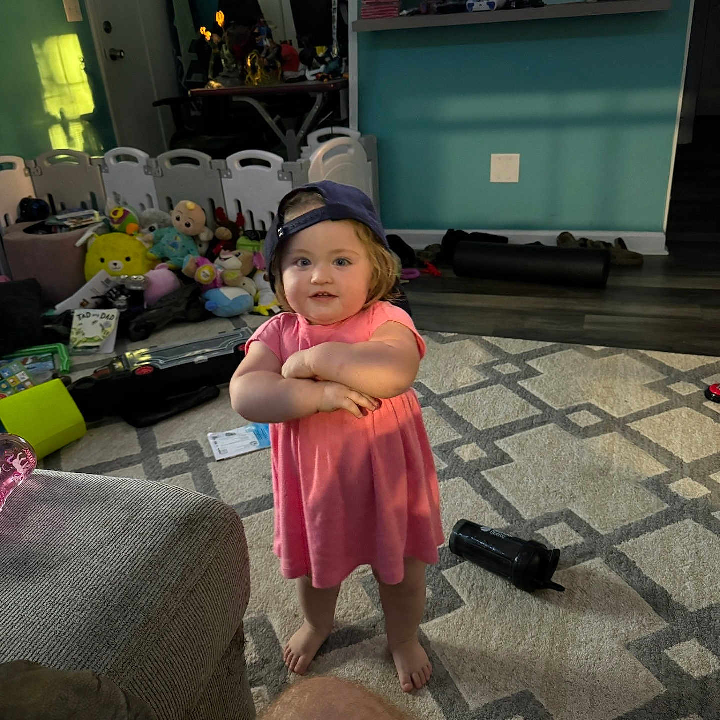 Hadley is registered to the contest to win money with this photo: architecture, building, clothing, computerhardware, couch, electronics, face, furniture, hardware, hat, head, indoors, livingroom, monitor, person, photography, portrait, room, screen, tv