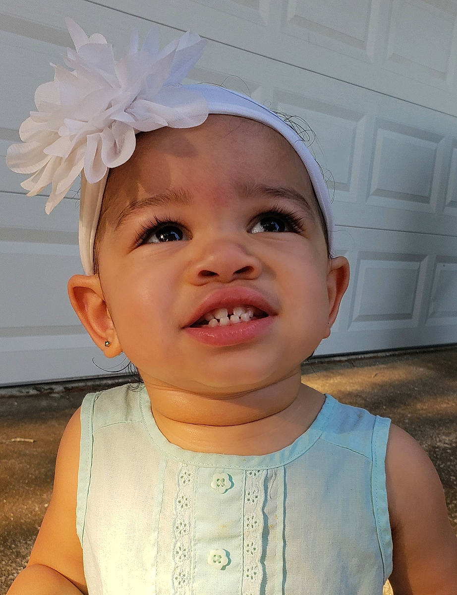 Nyla joined the competition — help win amazing prizes! baby_toddler_clothing, cheek, chin, door, eye, eyebrow, eyelash, face, facial_expression, hairstyle, happy, head, headwear, iris, lip, organ, person, pink, skin, sleeve