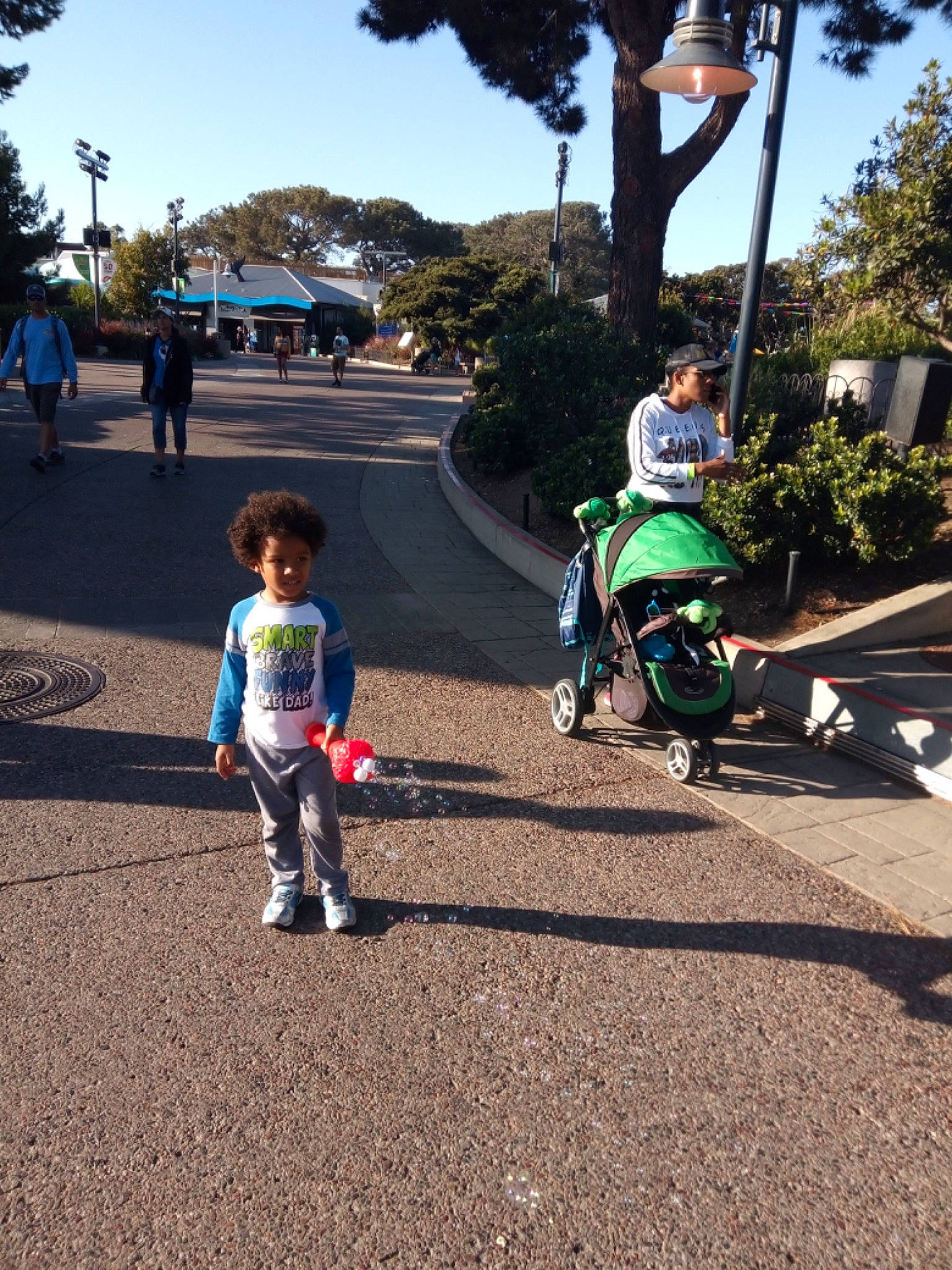 Bretton joined the competition — help win amazing prizes! asphalt, bicycle, child, headwear, leisure, person, plant, recreation, road, toddler, tree, vehicle, walking