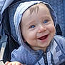 Liam is registered to the contest to win money with this photo: baby, blue_eyes, child, cute, fabric, face, grip, hand, happy, hood, infant, jacket, outdoor, person, portrait, seat, smiling, stroller, young, zipper