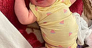 Charlie joined the competition — help win amazing prizes! newborn, baby, infant, sleeping, smiling, portrait, yellow_outfit, watermelon_pattern, blanket, bedding, cozy, indoors, baby_clothing, arms_raised, crossed_legs, soft_lighting, closeup, face, relaxed, cute